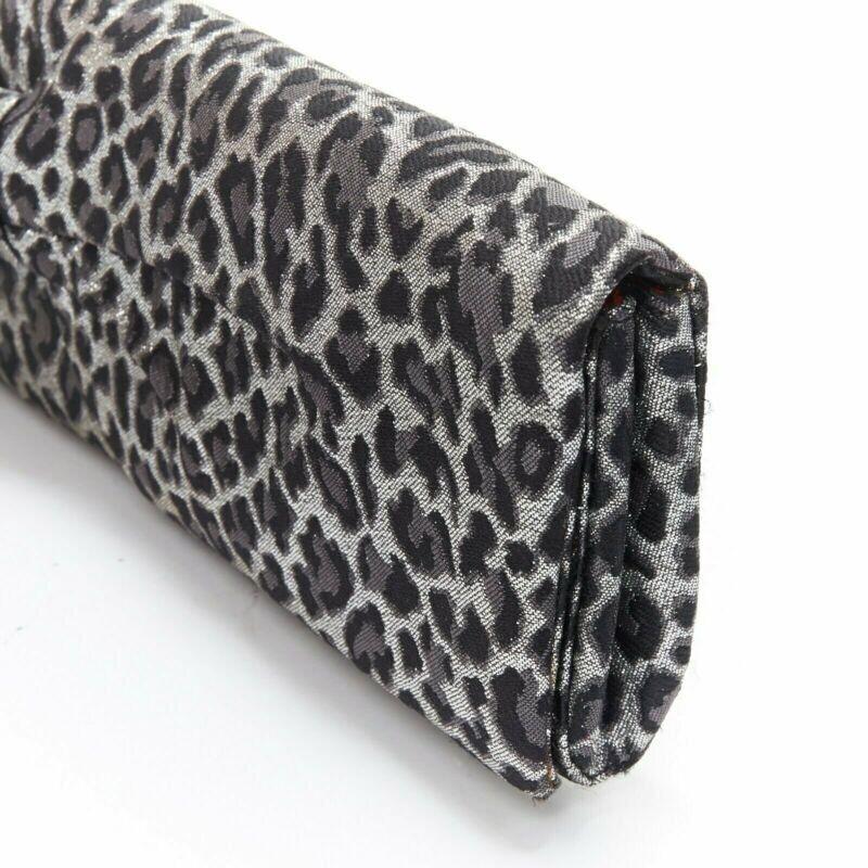 CHRISTIAN LOUBOUTIN Aionoeud silver leopard asymmetrical bow elongated clutch 1