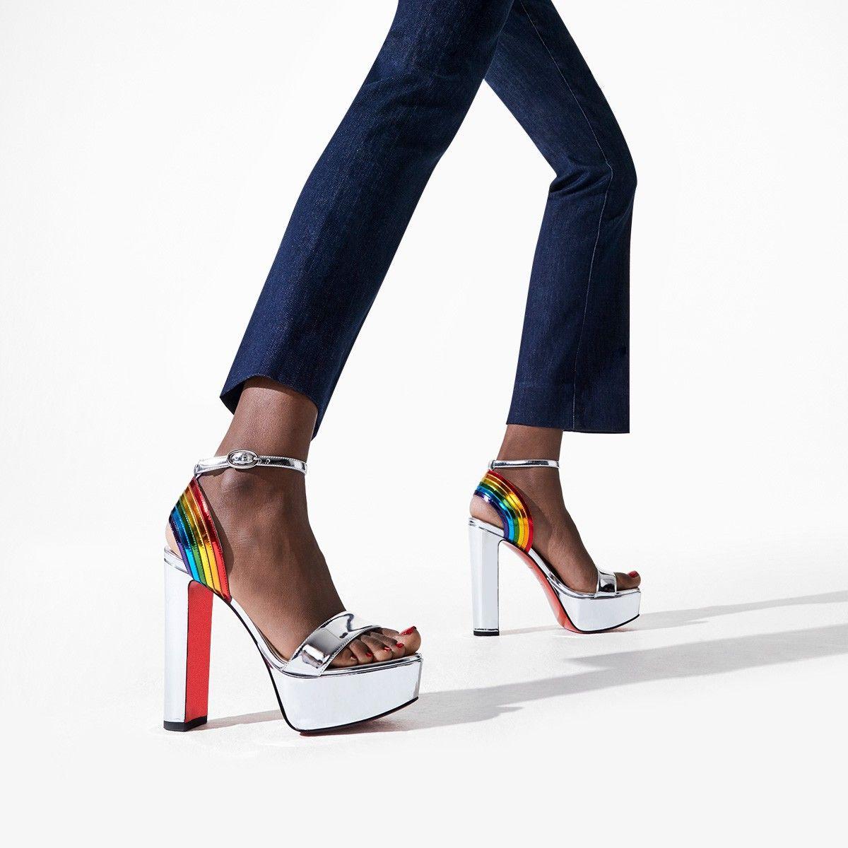 The 'Arkendisc Alta' sandals are made from silver leather and feature a bold rainbow strap. They're set on a dramatic 130mm block heel that's balanced by a 35mm platform and have the signature red soles. 