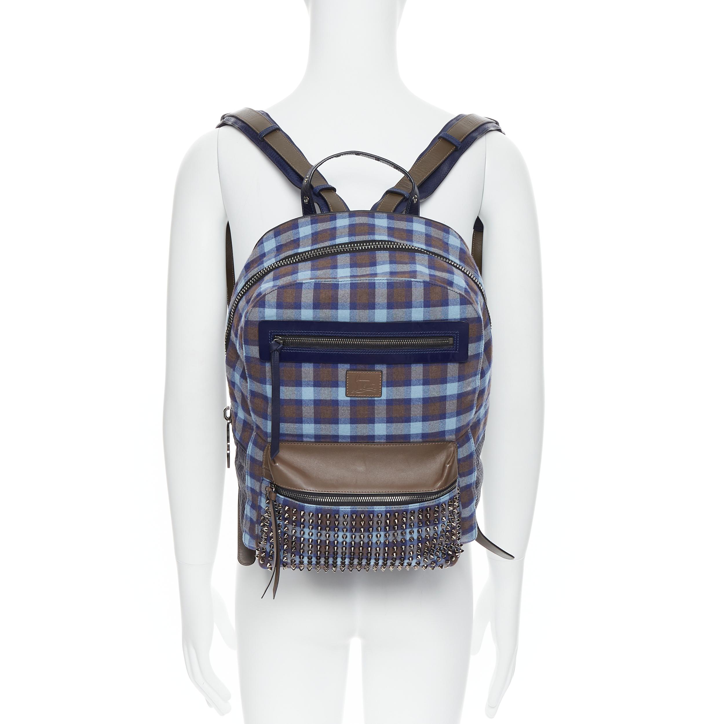 CHRISTIAN LOUBOUTIN Backloubi blue brown gingham check spike stud backpack bag 
Reference: TGAS/B00741 
Brand: Christian Louboutin 
Designer: Christian Louboutin 
Model: Backloubi 
Material: Fabric 
Color: Blue 
Pattern: Plaid 
Closure: Zip 
Extra