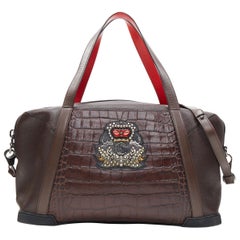 CHRISTIAN LOUBOUTIN Bagdamon CL studded stamped leather holdall weekender bag