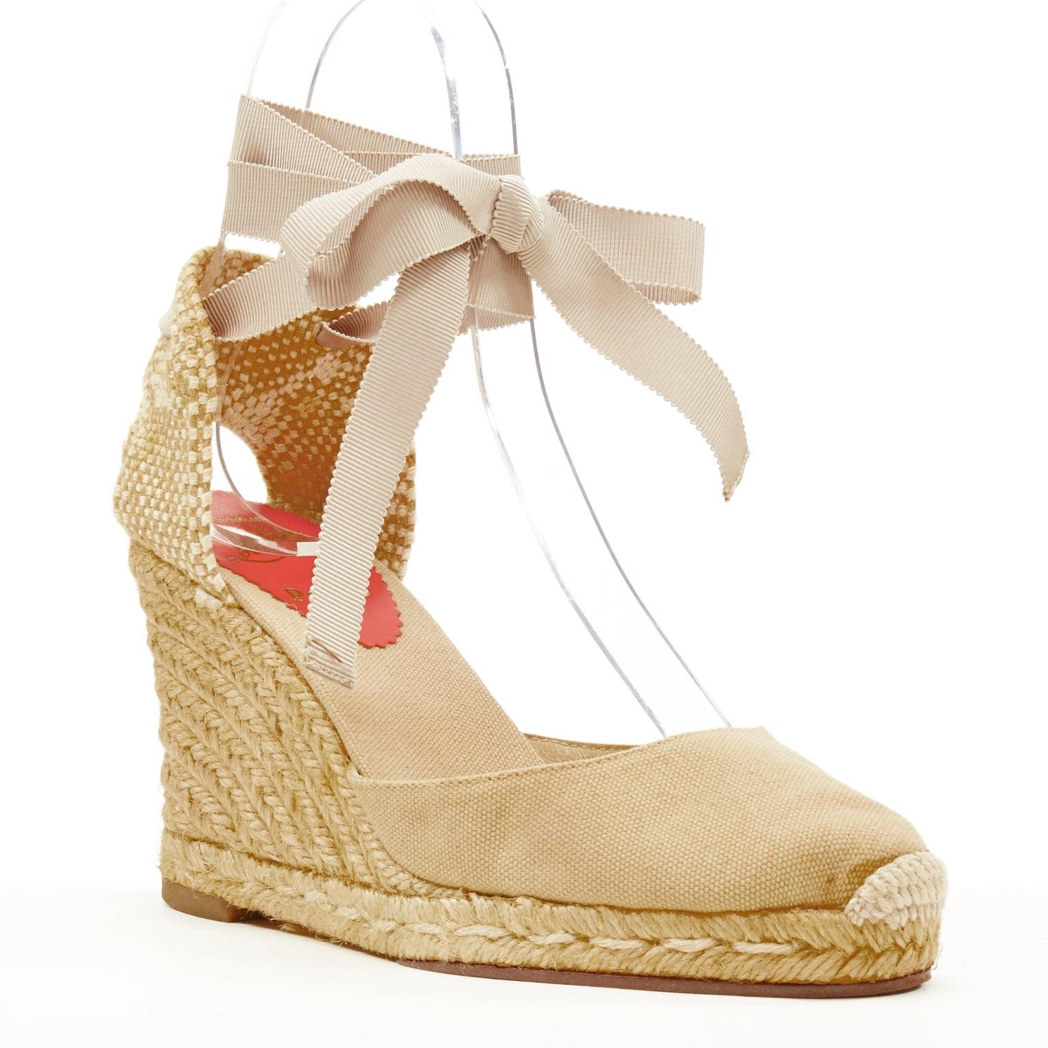 CHRISTIAN LOUBOUTIN beige canvas espadrille wedge ribbon tie heel EU37
Reference: SNKO/A00189
Brand: Christian Louboutin
Material: Canvas, Straw
Pattern: Solid
Closure: Self Tie
Lining:  Canvas
Extra Details: Brown canvas upper. Woven heel.