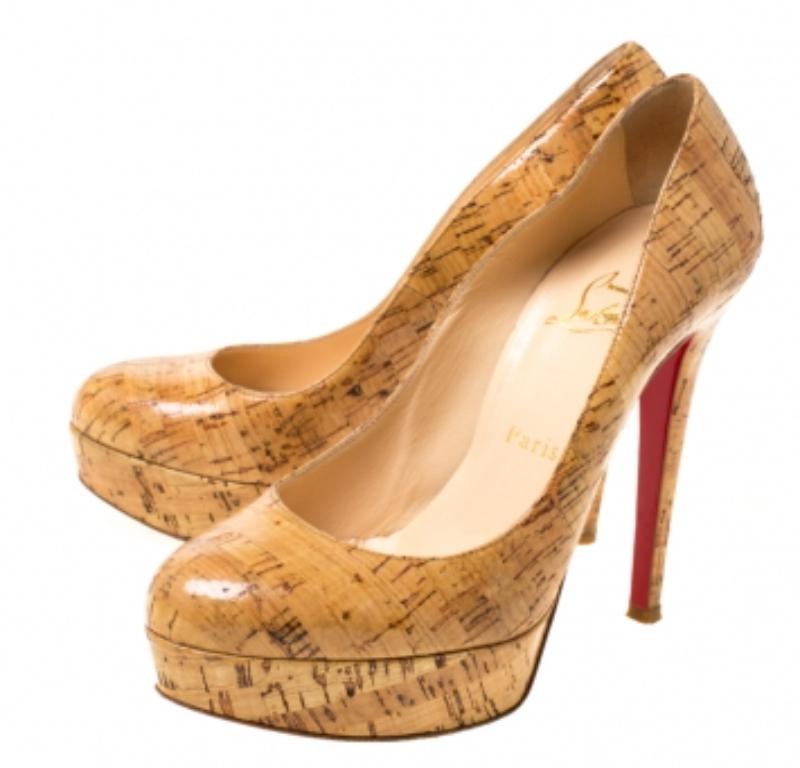 A classic to add to one's shoe collection is this pair. These Christian Louboutin beauties are covered in cork and styled with platforms, 12.5 CM heels, and the signature red soles. Add these pumps to your closet today and flaunt them with pride.