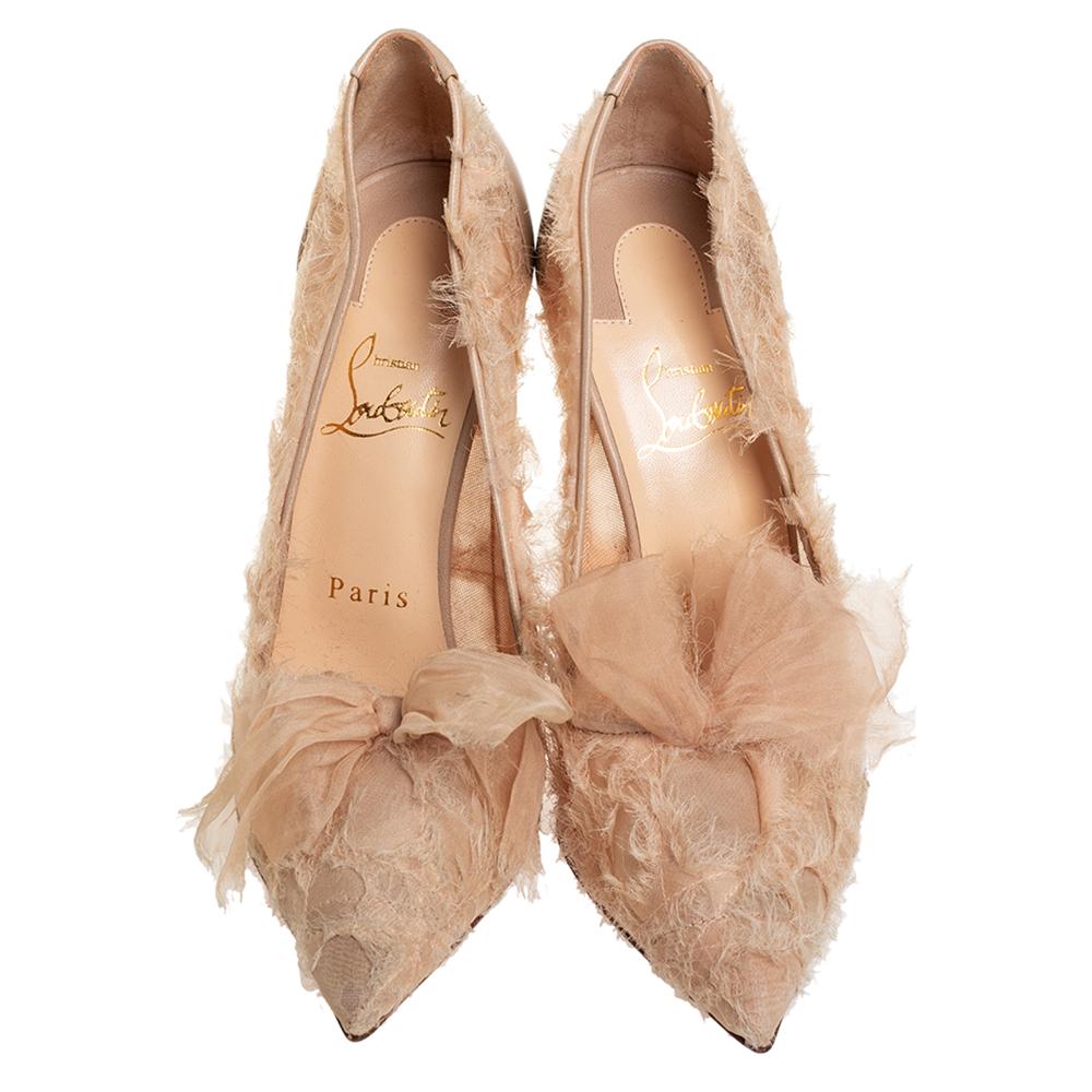 Christian Louboutin's TouFrou pumps bring feminine elegance to light using frayed organza and leather. The pointed-toe design is complemented by soft, sheer bows and 10 cm slim heels for a stunning silhouette.


