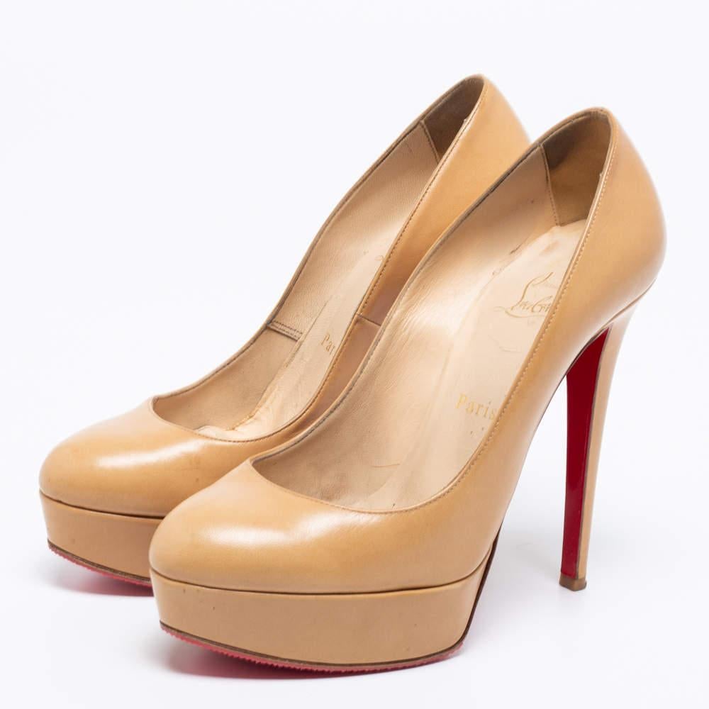 Embrace new styles and trends as you wear these Bianca pumps from the House of Christian Louboutin. They are made from beige leather, granting them an exceptionally glamorous look. These pumps show platforms, rounded toes, and pointy heels. These
