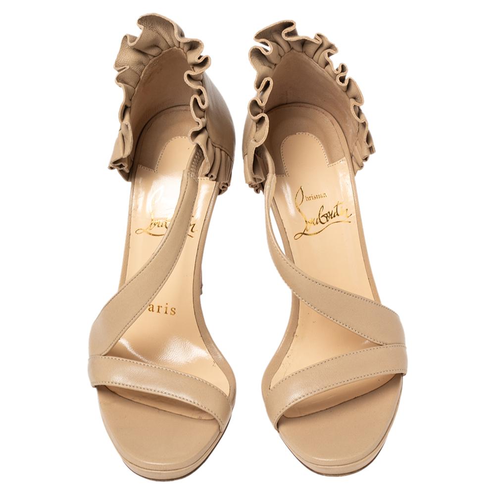 How stunning are these sandals from the House of Christian Louboutin! They are made from beige leather on the exterior and flaunt a beautiful ruffled detailing on the counters. Red-lacquered soles are added for a signature touch. Let these dreamy Cl