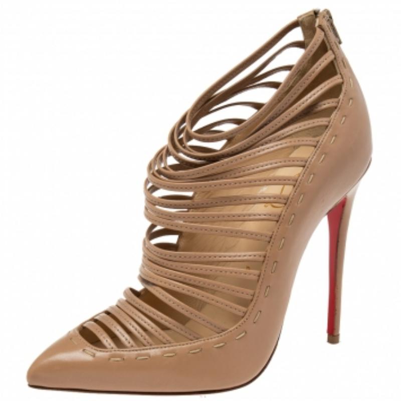 Crafted from leather, these Christian Louboutin boots are high on the fashion scale. They feature pointed toes and zip fastenings at the counters. The fronts display a strappy caged pattern right up to the ankles. Lined with leather, these strappy