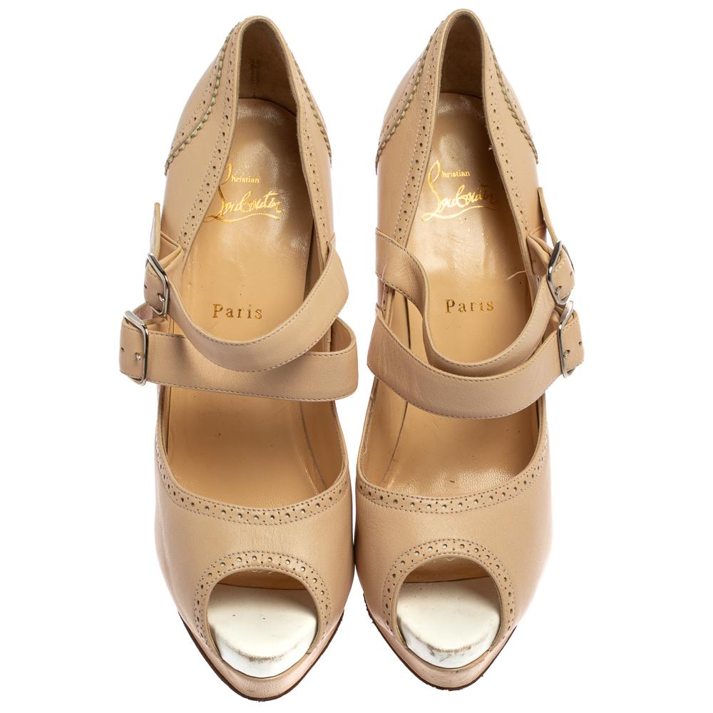 Made from leather, this pair of platform pumps will add a classic touch to your collection of heels. Designed in a Mary Jane style with peep toes, dual buckle fastening straps across the vamps, and 15.5 cm heels, this beige pair by Christian