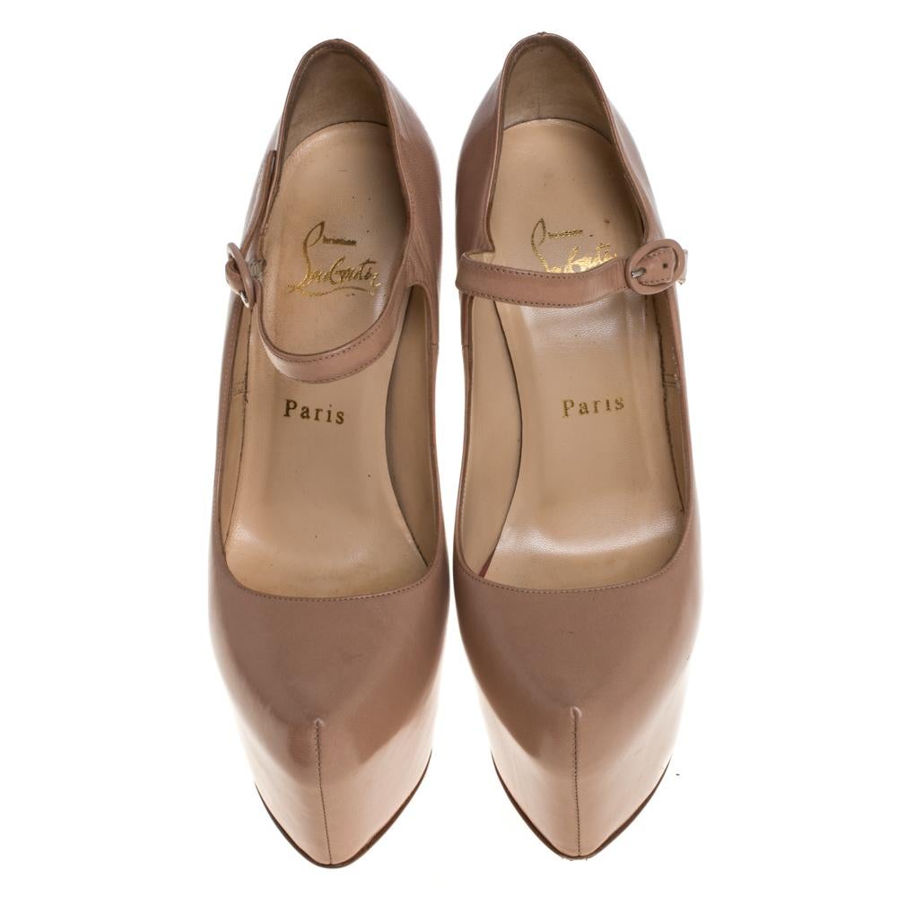 Enjoy every step in this ultra-comfortable pair of Mary Jane pumps from Christian Louboutin. The beige pair is crafted from leather and has a peep-toe style. It features a platform, stiletto heel, and a buckle closure at the ankle. The pumps have a