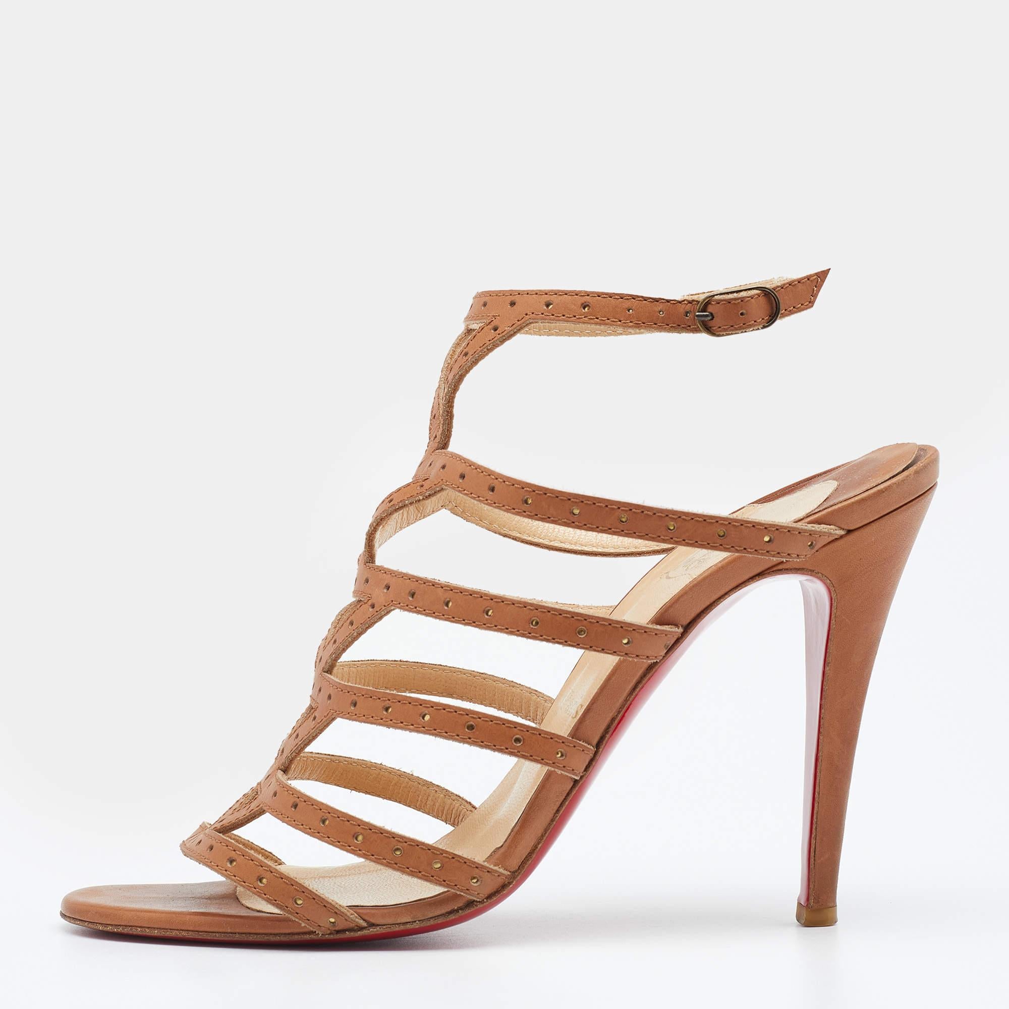 Frame your feet fashionably with these Christian Louboutin sandals. Crafted from beige leather, they feature a strappy upper, an ankle buckle closure, and 12cm heels.

