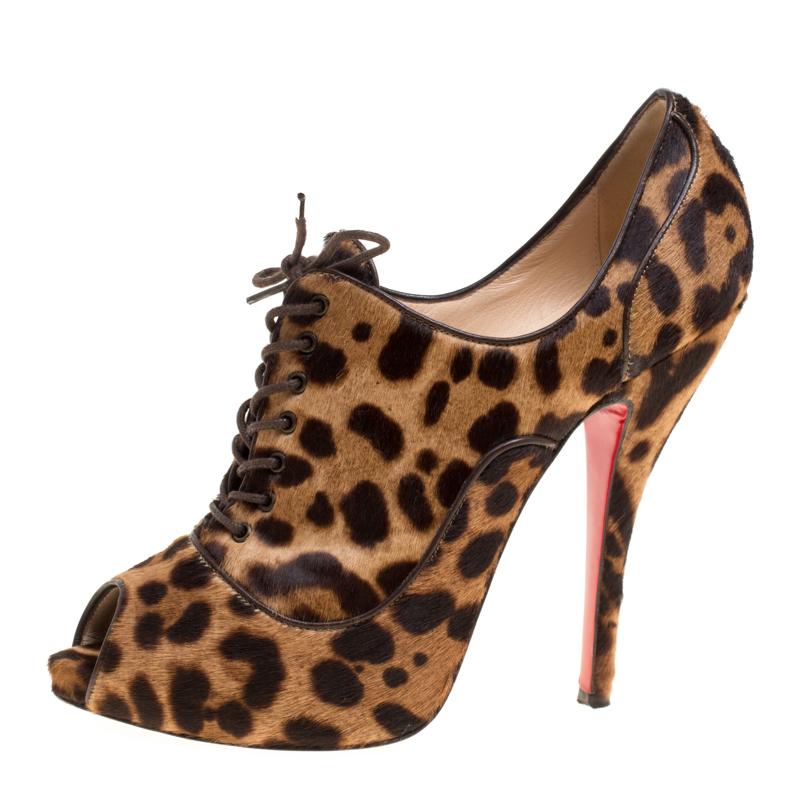 These booties from Christian Louboutin are bearers of a fine mix of shoe craftsmanship and style. They are covered in leopard-printed calfhair and styled with peep toes, laces and finely-sculpted heels that will beautifully lift you and your