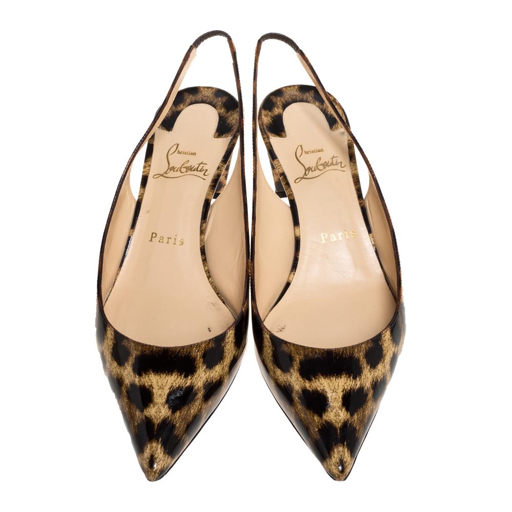These ultra-chic pumps from Christian Louboutin are a must have in your shoe closet. Designed in Italy, they are made from patent leather and feature a leopard print all over. The pumps are completed with a slingback design, pointed toes, and