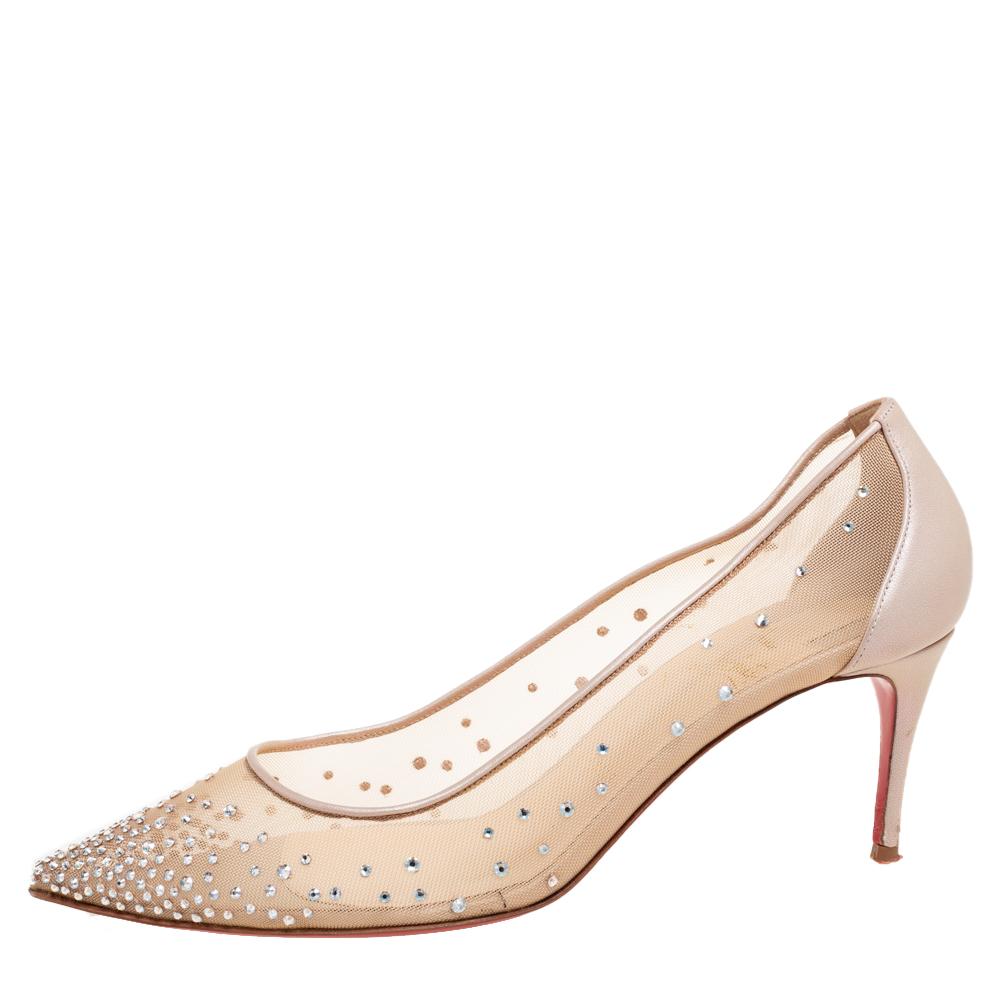 Add a statement finish with these Louboutins. Crafted from mesh, these Follies Strass pumps carry eye-catching details, pointed toes, and 7 cm heels. Complete with the signature red soles, this pair truly embodies the fine art of