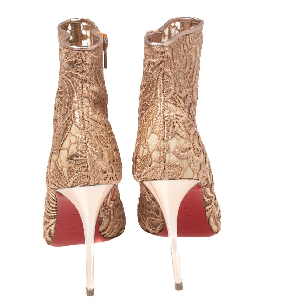 Exhibit an extravagant style as you wear these ankle boots. These ankle boots made by Christian Louboutin derive a dramatic style with their fancy exterior and overachieving design. Their shape flaunts beige net and mesh with the signature red