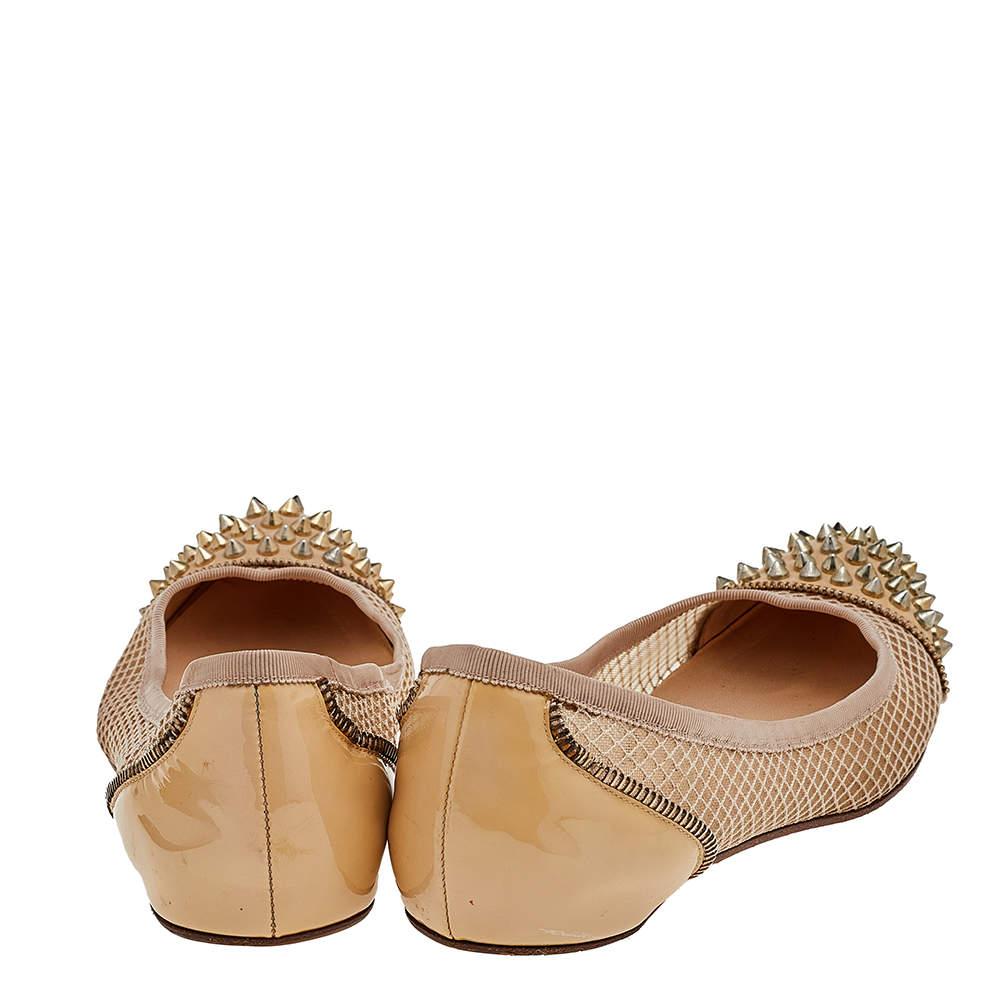 From the House of Christian Louboutin, these ballet flats are everything you need to appear glamorous and splendid. They are made using beige patent leather and mesh with gold-toned Spike embellishments accentuating the rounded toes. They are made