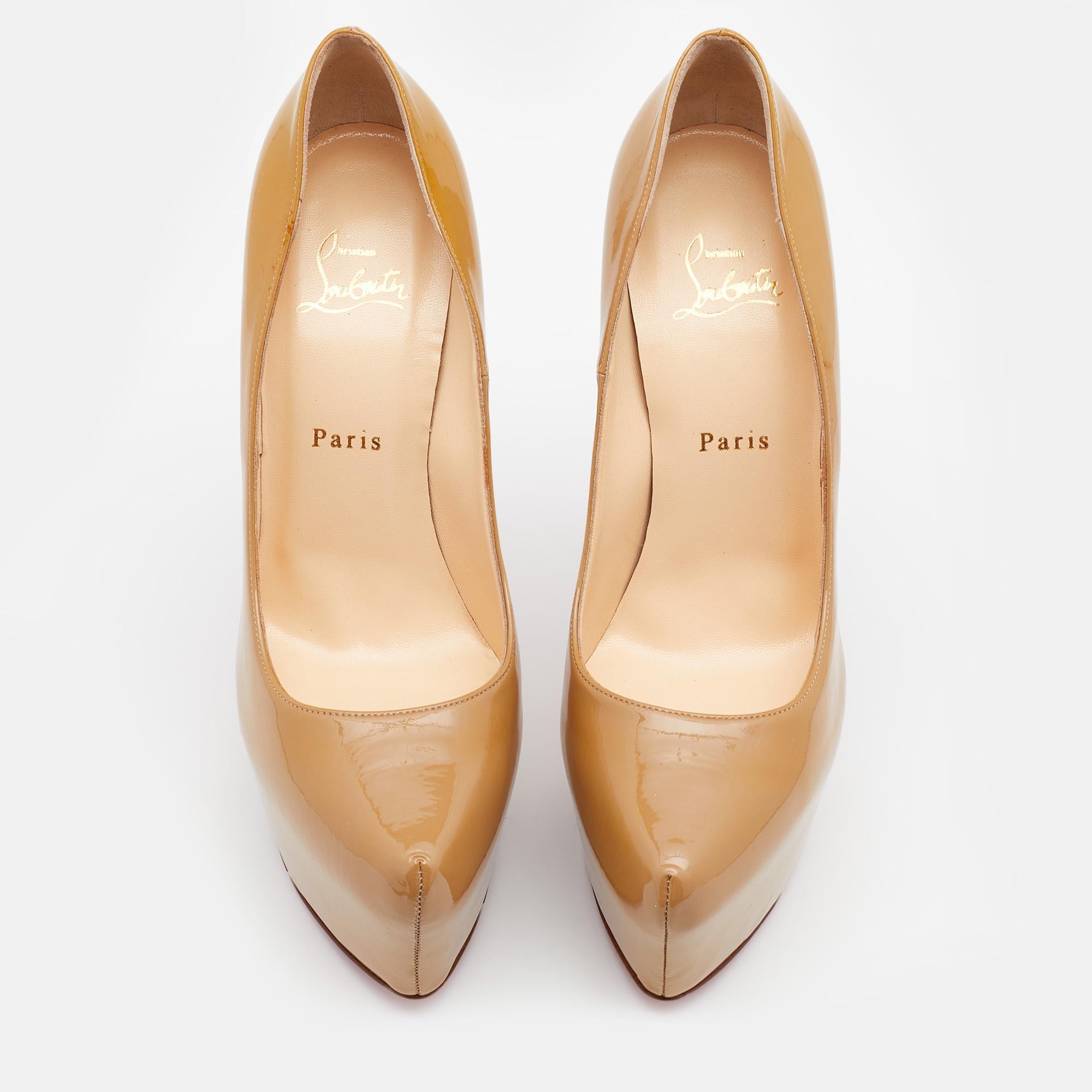 These gorgeous platform pumps from Christian Louboutin epitomize the concept of high fashion. They are crafted from beige patent leather and designed with chunky platforms. They are equipped with comfortable leather-lined insoles and are elevated on