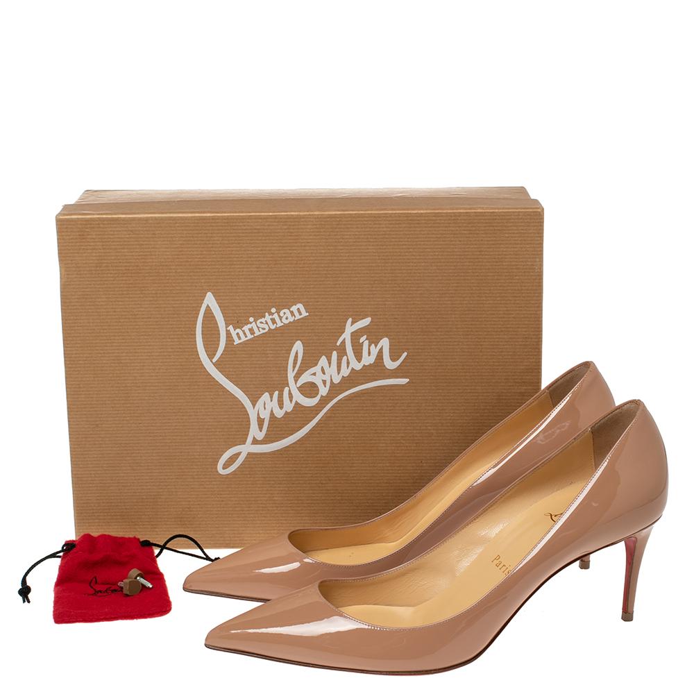 Crafted from patent leather, these beige Kate 70 pumps by Christian Louboutin carry a classy shape with pointed toes and 7 cm heels. Complete with the signature red soles, this pair truly embodies the fine art of shoemaking.

Includes: Extra Heel