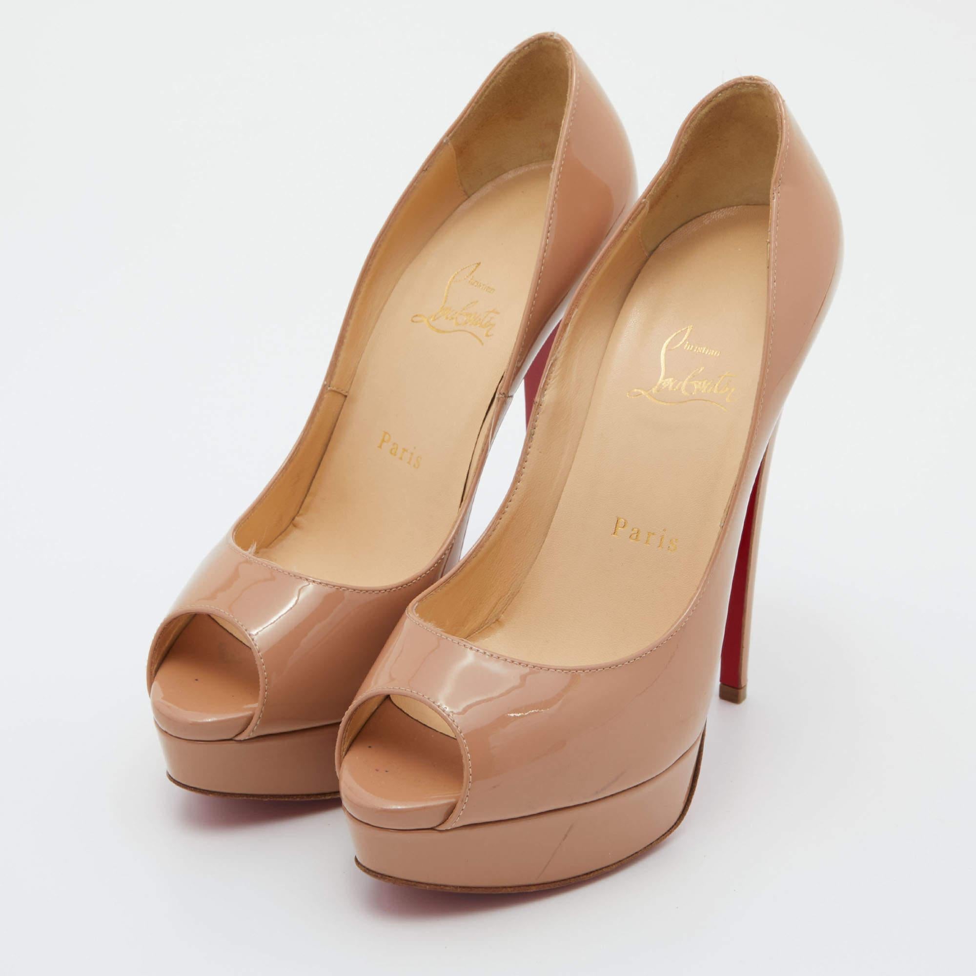 Stand out from the crowd with this luxurious pair of Louboutins that exude high fashion with class. Crafted from patent leather, this is a creation from their Lady Peep collection. It features a beige shade with peep toes and an architectural shape.