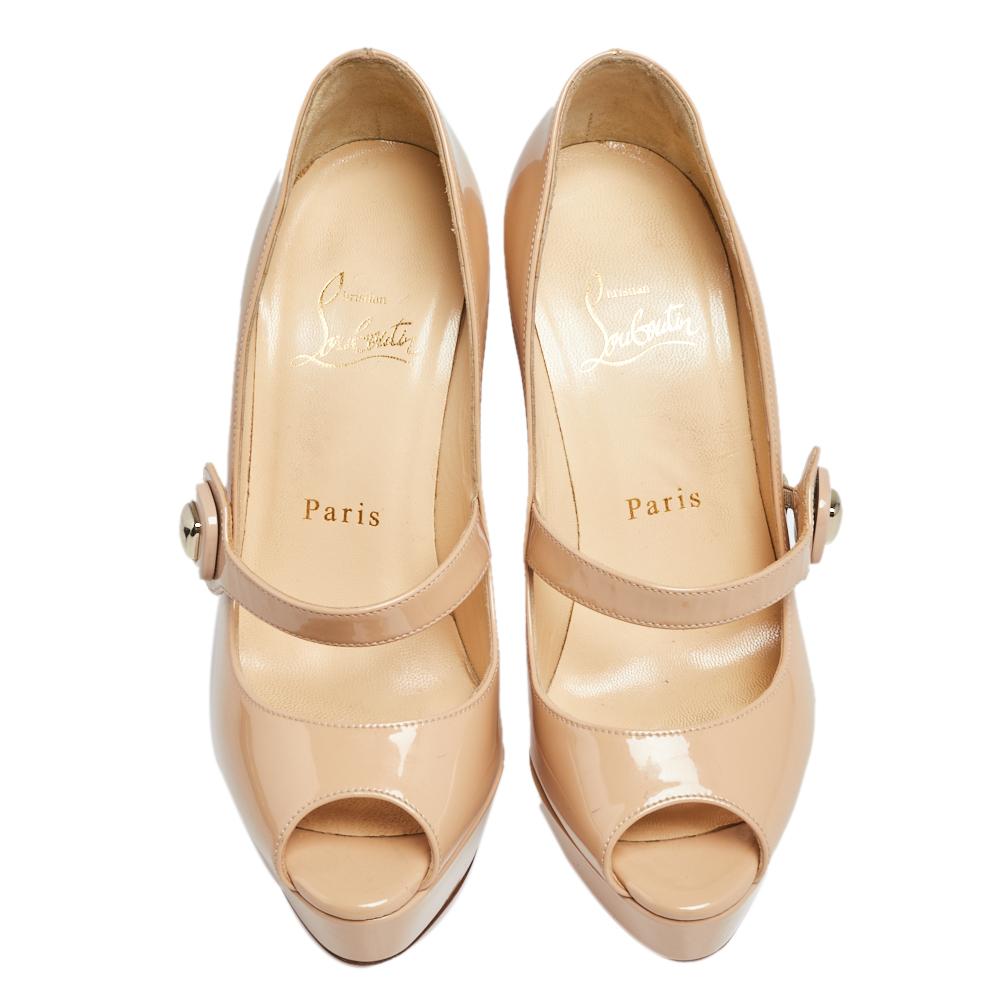 Look chic and make an elegant style statement in this pair of patent leather pumps. Enhance your look by adding these Christian Louboutin pumps to the ensemble. They are designed in a mary-jane style with platforms and high heels.

