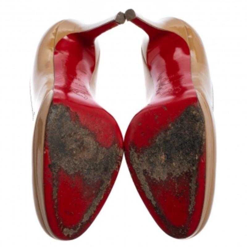 Louboutins are designed to lift one's attitude and outfit. Let this pair lift yours as well by owning them today. Crafted from patent leather, these beige pumps carry round toes and a chic silhouette. Completed with stiletto heels, platforms, and