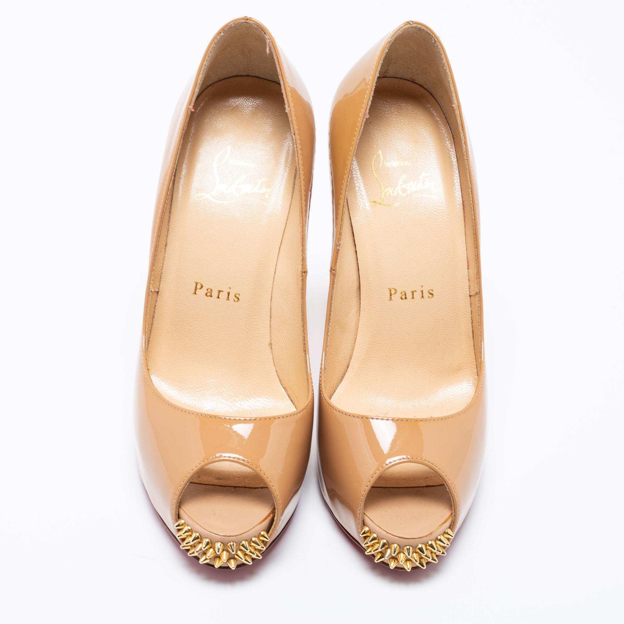The architectural silhouette and precise cuts of this pair of pumps from Christian Louboutin exemplify the brand's mastery in the art of stiletto making. Finely created from patent leather, the gold-tone studs enhance its chicness and it is lifted