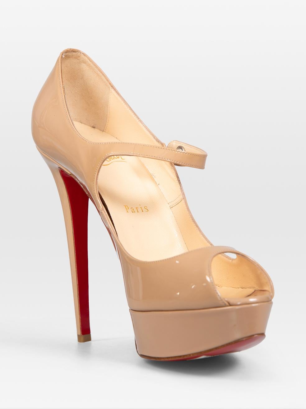 CONDITION is Very good. Minimal wear to the heels is evident. Abrasion on the left counter. Visible glue on the left platform and tip of the right insole. Discolouration on the right in sole on this used Christian Louboutin designer resale item.