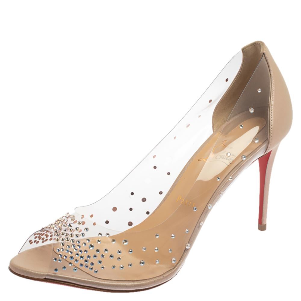 These beige pumps from Christian Louboutin are meant for seasons of comfort and style. Crafted from crystal-embellished PVC and leather, they feature an elegant shape, peep toes, and 9 cm heels meant to elevate you with ease. These pumps are a