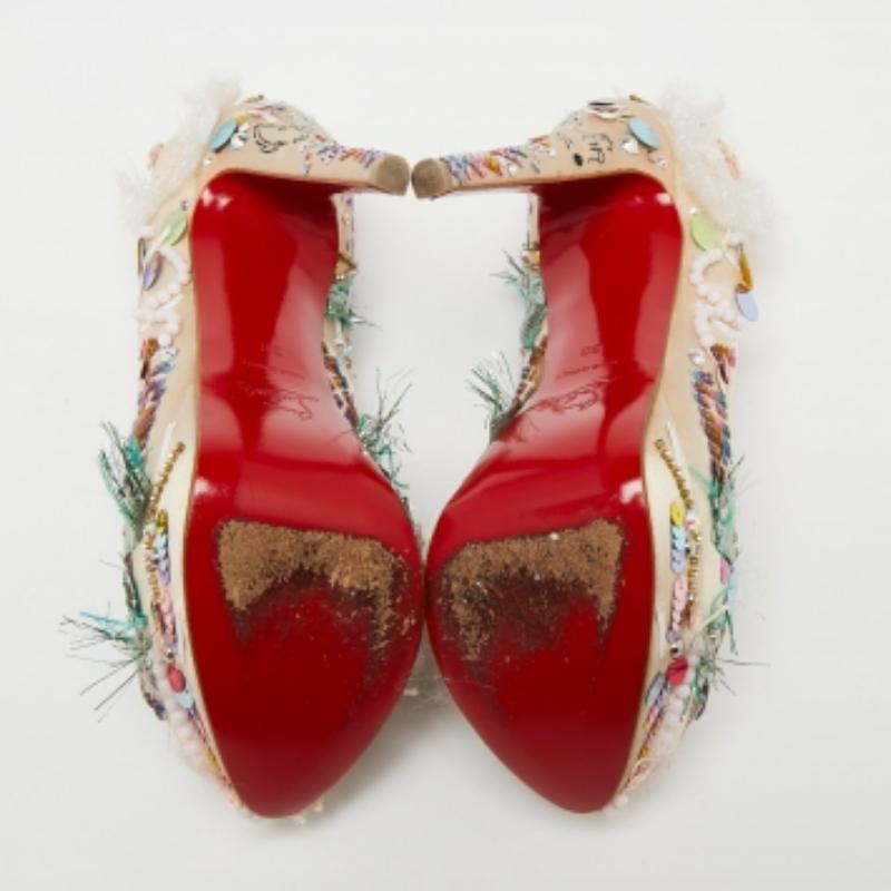 Deliver statement looks with these pumps from Christian Louboutin! From their shape and detailing to their overall appeal, they exude sophisticated style. The pumps come crafted from beige-hued satin and are designed with embellishments, platforms,