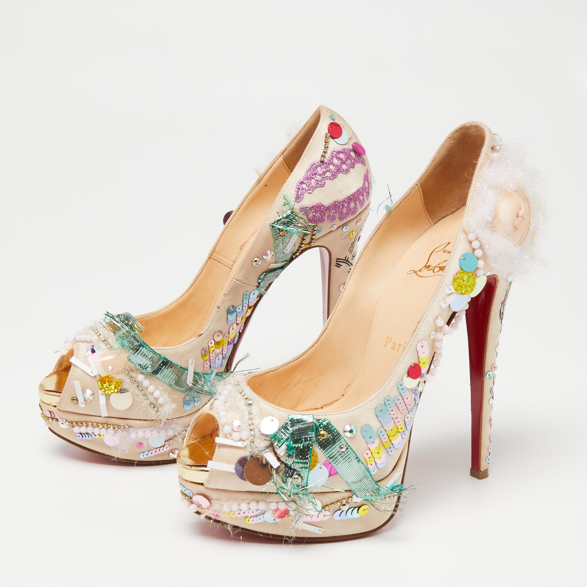 Deliver statement looks with these pumps from Christian Louboutin! From their shape and detailing to their overall appeal, they exude sophisticated style. The pumps come crafted from beige-hued satin and are designed with embellishments, platforms,