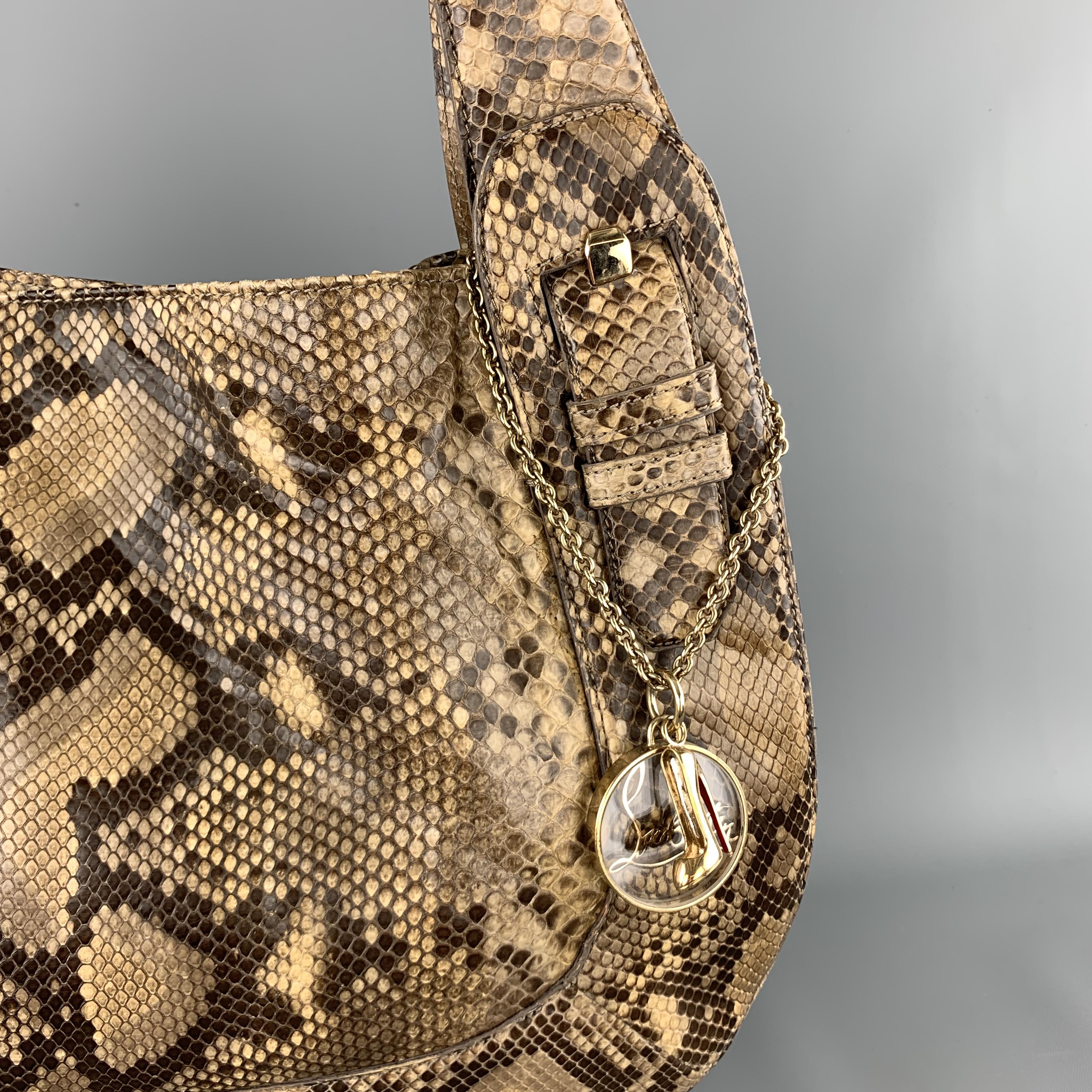 CHRISTIAN LOUBOUTIN shoulder bag comes in beige snake skin leather with double leather buckle accented shoulder straps, gold tone metal chain with charms, and red twill liner. 

Very Good Pre-Owned Condition.

Measurements:

Length: 15.5 in.
Width: