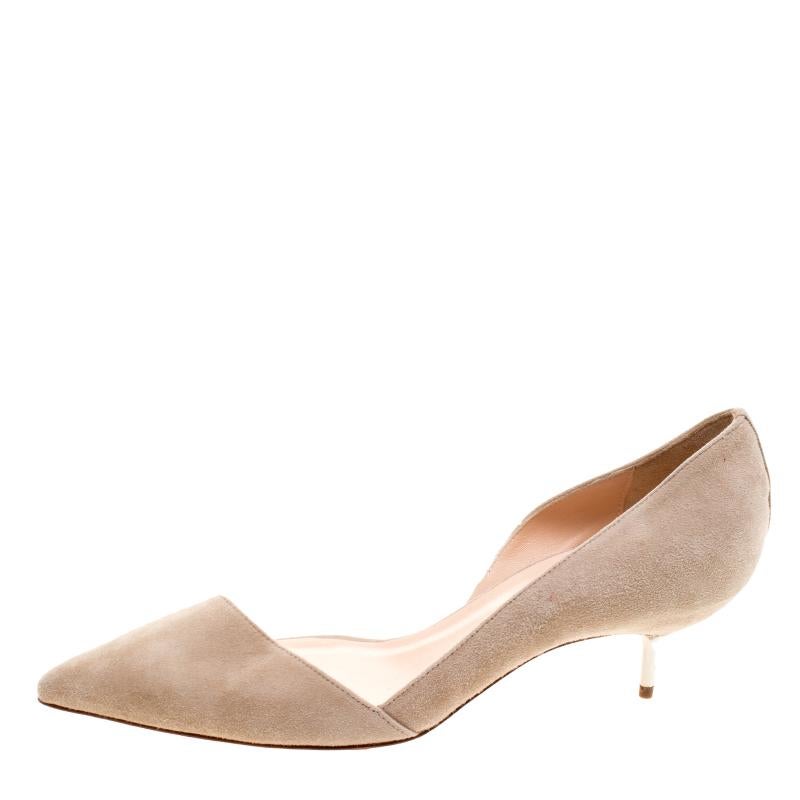Christian Louboutin Beige Suede Newton D'Orsay Pumps have a soft cut-out vamp giving it a subtle feminine body. With short heels and a soft colour, these shoes were made for a more demure and low-key event. These may not be your usual, but step out