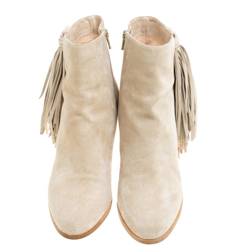 Everything about this pair of boots is subtle and elegant. From the house of Christian Louboutin, these ankle boots are for women who like minimal fashion. They have been fabulously crafted in a classic silhouette with suede in a subtle beige hue.