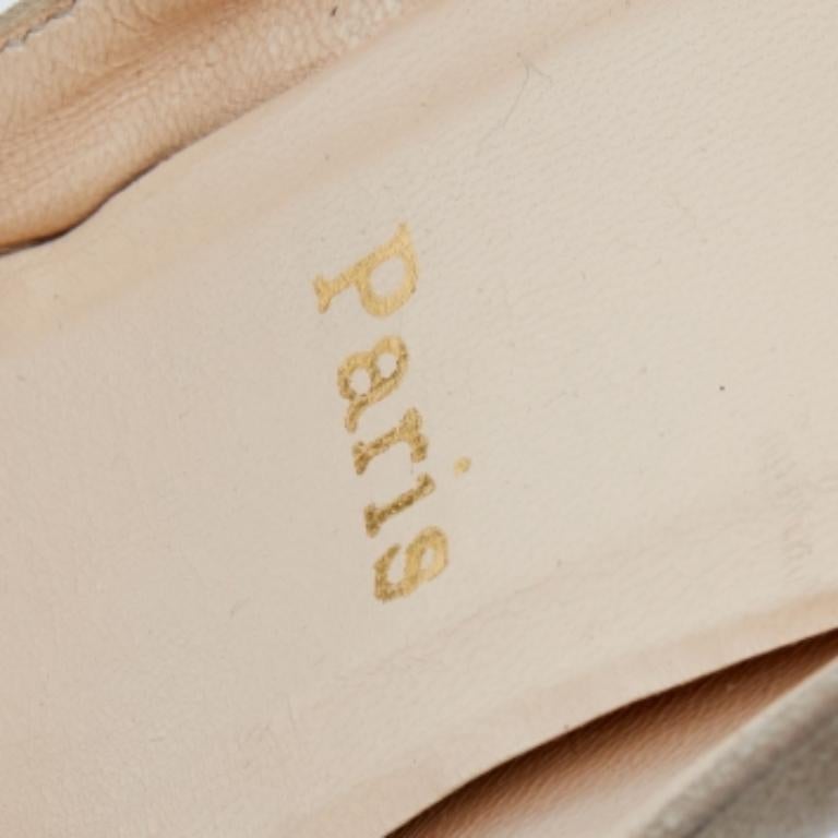This stunning pair of Christian Louboutin pumps is a timeless classic. Step out in style while flaunting these beige suede pumps that are decorated with crystal embellishments near the toes. They feature peep toes, platforms, and gorgeous 11.5 cm