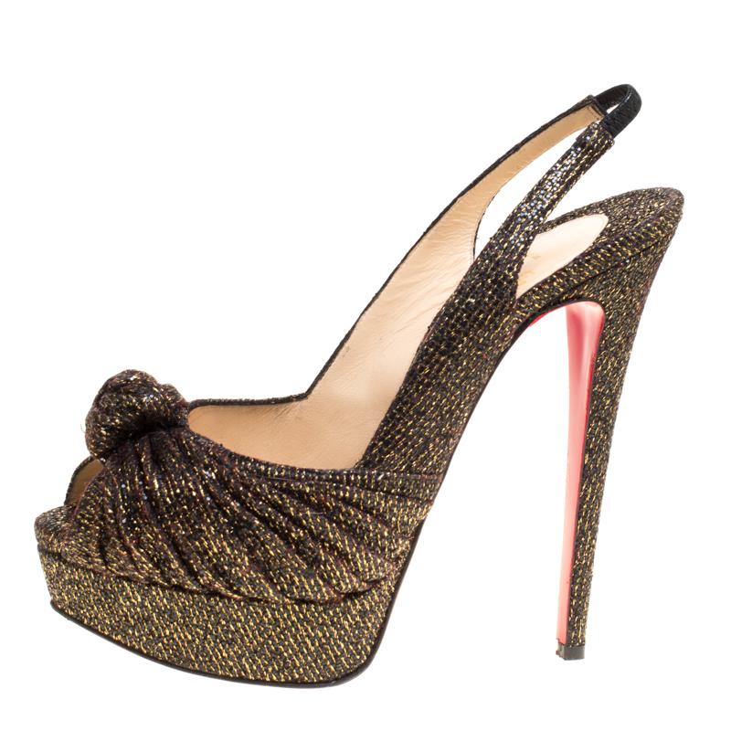 Step brightly in these glittery Louboutins. The glittered fabric is gathered to form a knot at the vamps. These pumps come equipped with elaticized slingback straps and leather lined insoles. Whether you dress these up or down you can be sure that