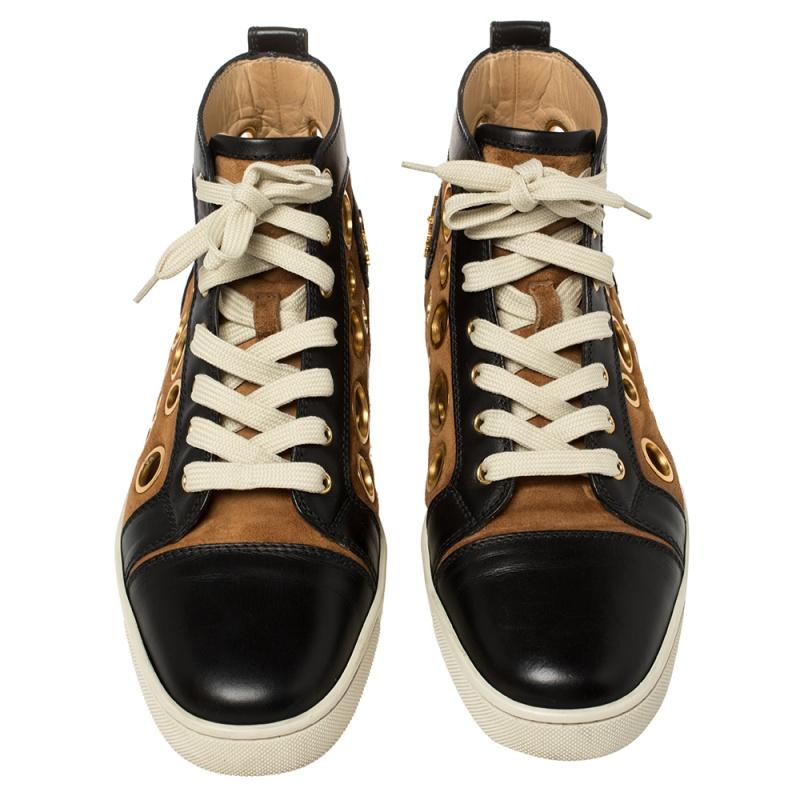 Stylish, chic, and comfortable, these Christian Louboutin sneakers can amp up your look instantly. Crafted from suede and leather in brown and black shades, they are adorned with eyelets that give an impression of bubbles. Finished off with laces,