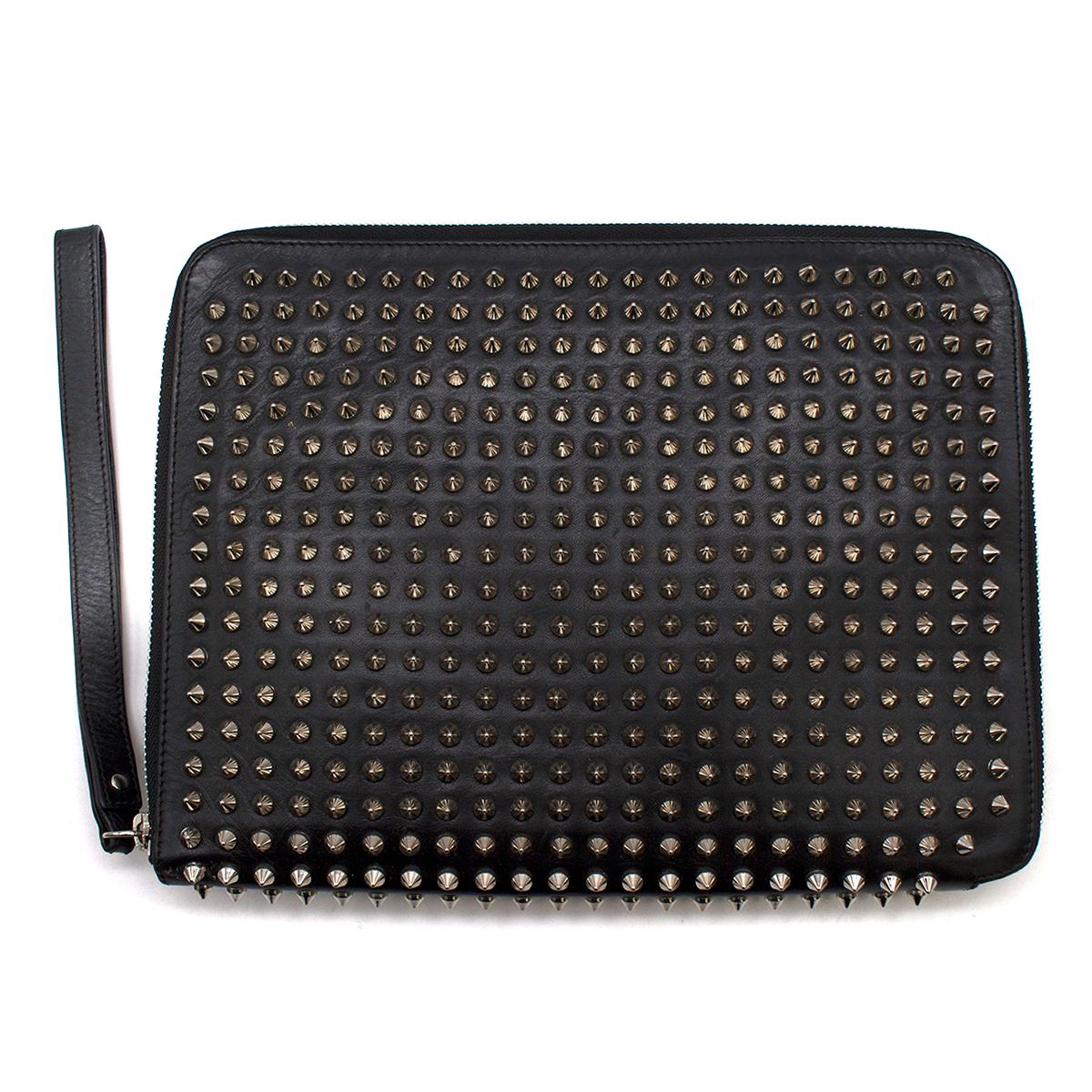 Christian Louboutin Black Cris Spiked Leather Ipad Case

-Black iPad case with silver tone spikes
-Silver tone zip closure
-One interior slot for an iPad and one zipped pocket
-The case can also be worn as a clutch

Please note, these items are