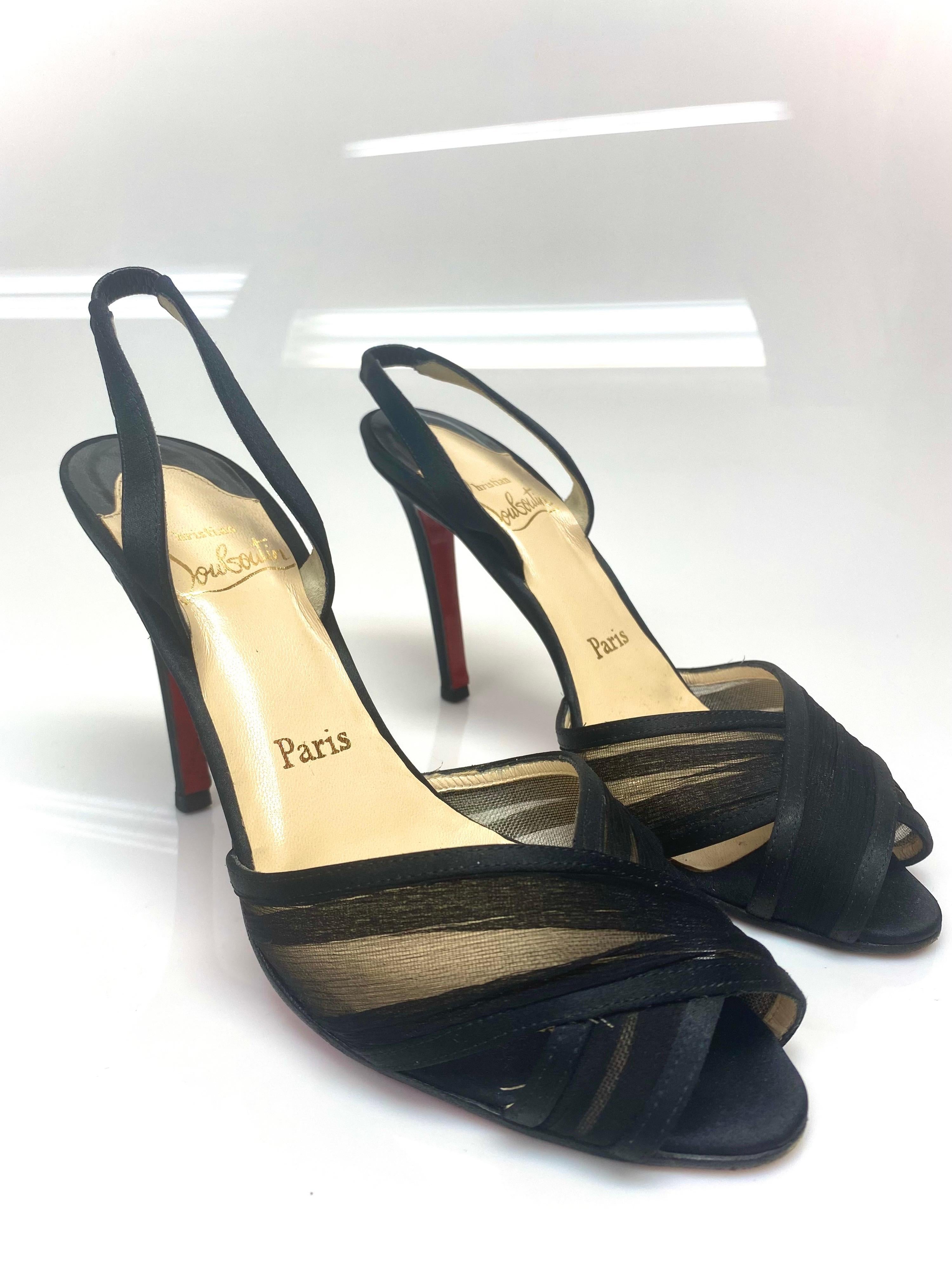 These Christian Louboutin heeled sandals are a reflection of the label's immaculate artistry in shoemaking. Beautiful black criss-cross detailing line the front of the shoe and they're secured with slingbacks. Condition is good but there are signs