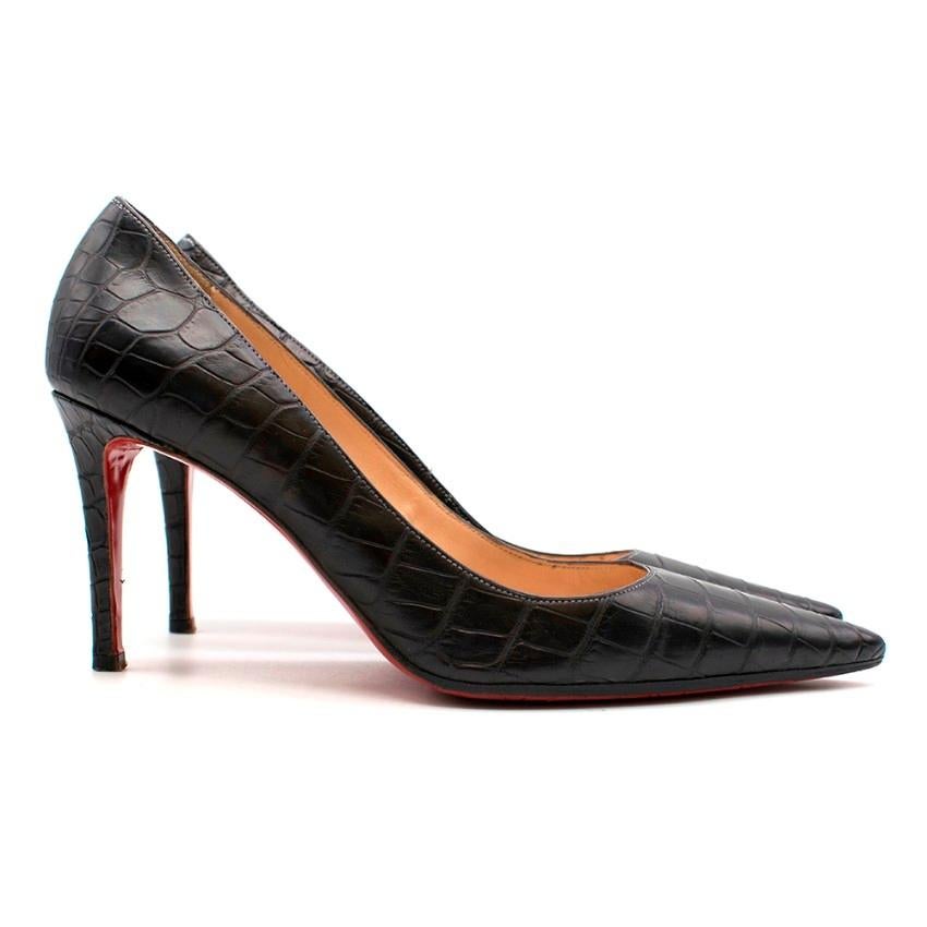 Christian Louboutin Black Crocodile Pointed Pumps

- Pointed toe
- High heels
- Classic red bottoms
- Nude leather lining
- Light grey contrast stitching

Material
- Calf leather, crocodile embossed
- Leather insole
- Leather sole with rubber ball