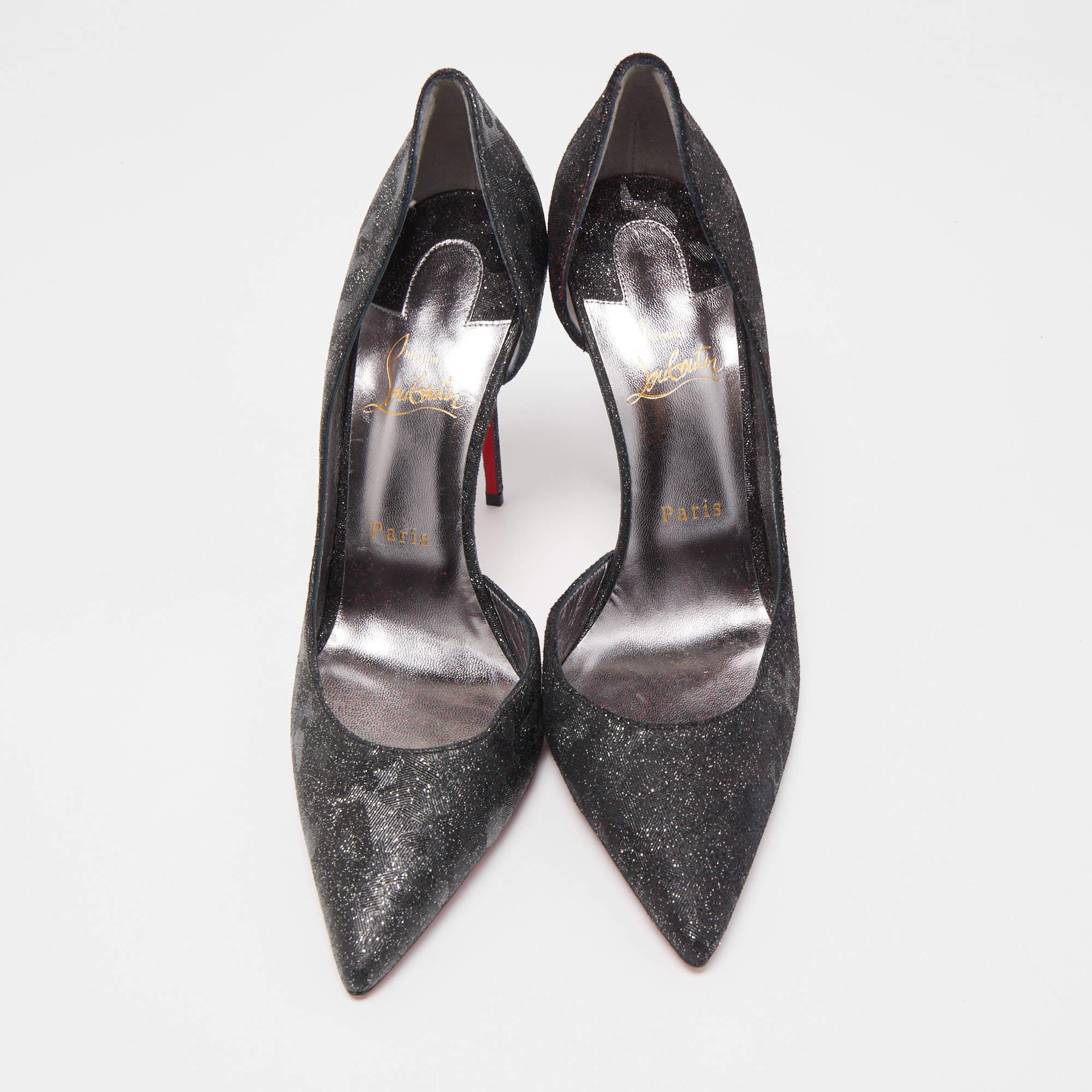 Skilfully crafted from glitter in a D'orsay style with pointed toes, these Christian Louboutin pumps come ready to give you a high-fashion experience. The black glitter pumps, with sharp-cut toplines, are balanced on slim heels and finished with red