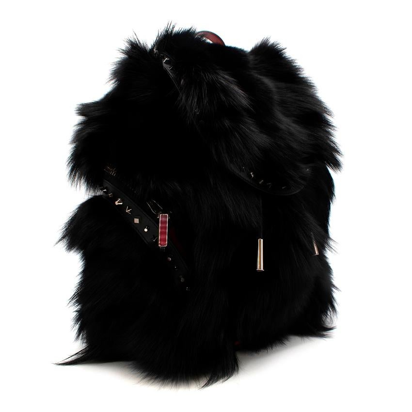 Christian Louboutin Black ExploraFunk Fur Backpack
 

 -With it's athletic nomad look -The Explorafunk backpack in black fox fur sports impressive softness and luxe details built on a durable rubber base. 
 -A mix of silver studs adorn the edges of