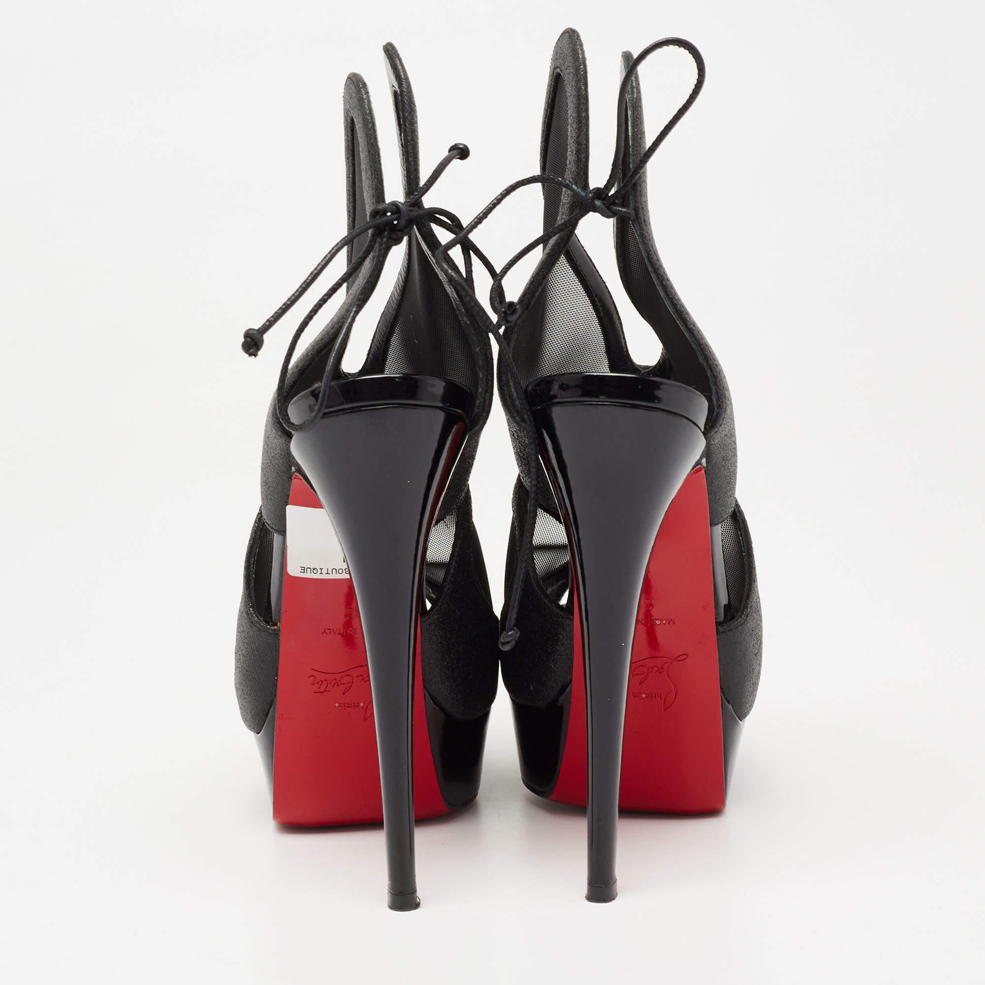 With these gorgeous booties from the House of Christian Louboutin, elegance, poise, and luxury come easy! They are designed using black glitter and mesh into an ankle-length profile. They display platforms, peep toes, and tall heels. Look fabulous