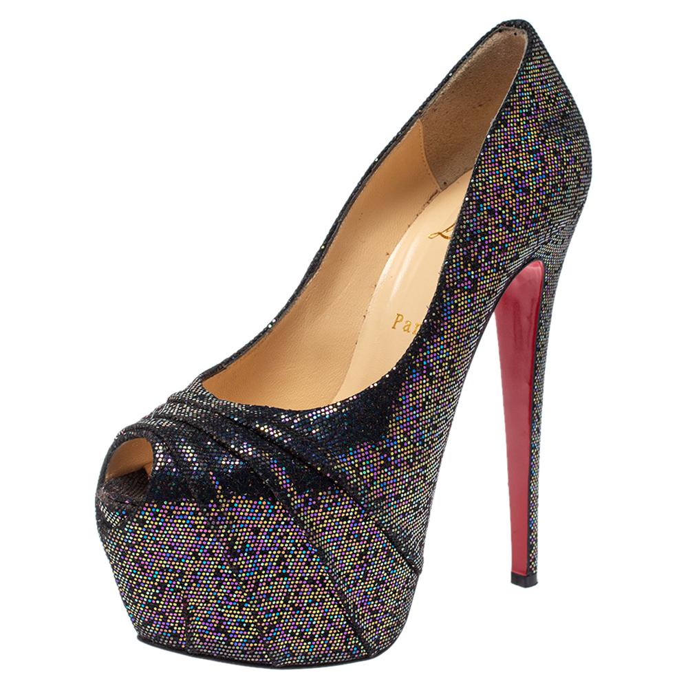 Stun the crowd when you wear these 160 Spotlight pumps by Christian Louboutin! They are made from black-hued glitter fabric and feature the signature red soles. These 16 cm high heeled platform pumps are leather-lined with the brand