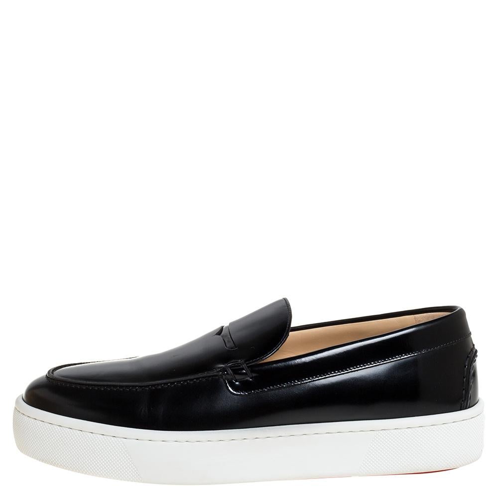 One's wardrobe is incomplete without a good pair of sneakers and what better than these Paqueboat ones from Christian Louboutin! These slip-on sneakers have been crafted from black glossy leather and are styled with round toes and contrasting white