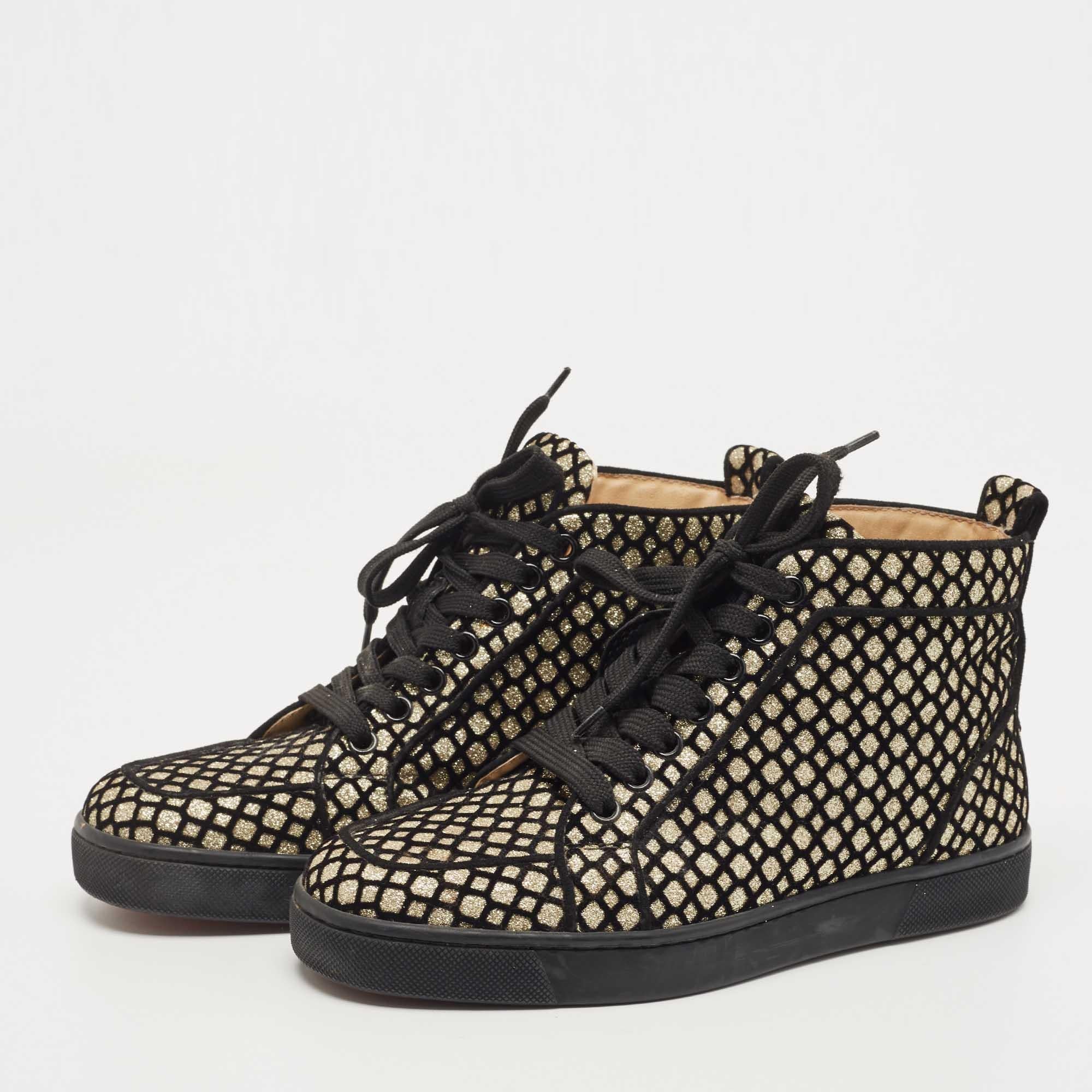 Stand out in a crowd in this pair of Rantus Orlato sneakers by Christian Louboutin. They are designed in high-top silhouette and feature a glamorous appeal. These lace-up shoes have contrasting black piping and the signature red rubber sole. The