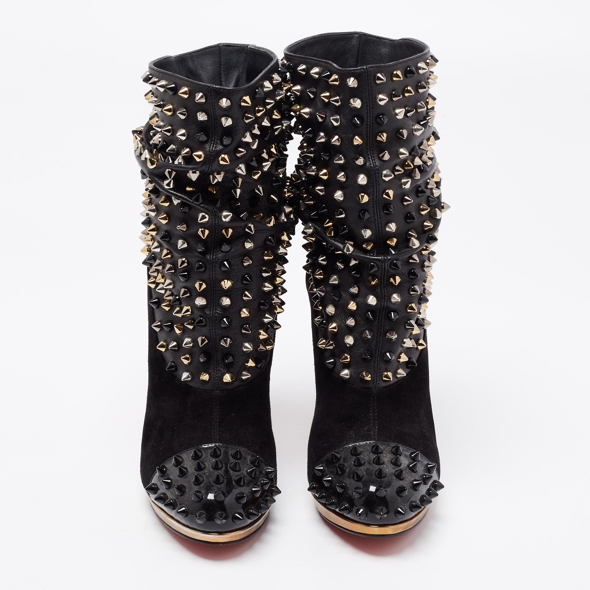 These Christian Louboutin booties will add an extra edge to your outfit. Created from leather, suede, and patent leather, the addition of spikes make them undeniably chic and the 10cm heels of this pair will lend you bold steps. The signature