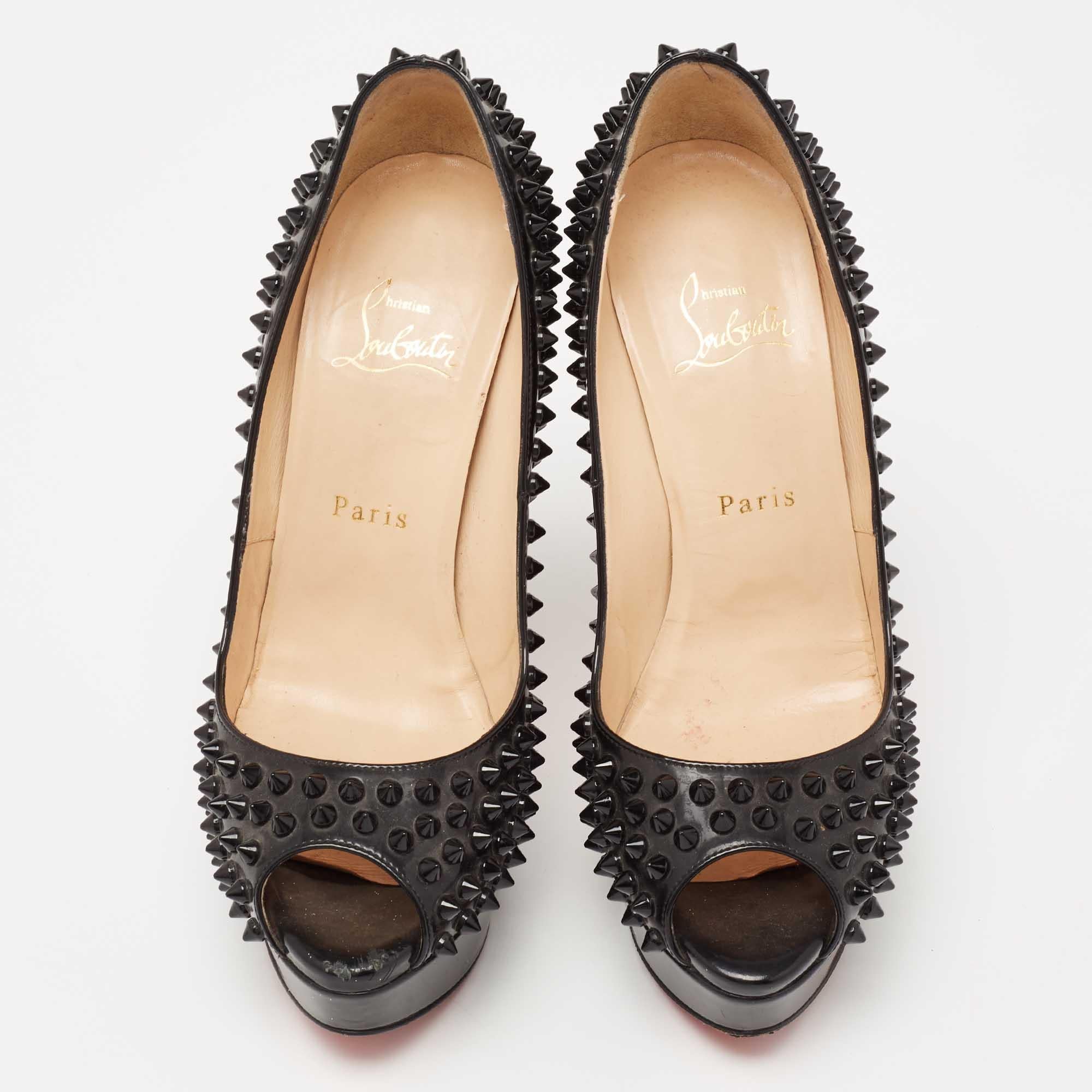 Stand out from the crowd with this gorgeous pair of Louboutins that exude high fashion with class! Crafted from patent leather, this is a creation from their Lady Peep collection. They feature a classic black shade with peep toes and tonal spikes