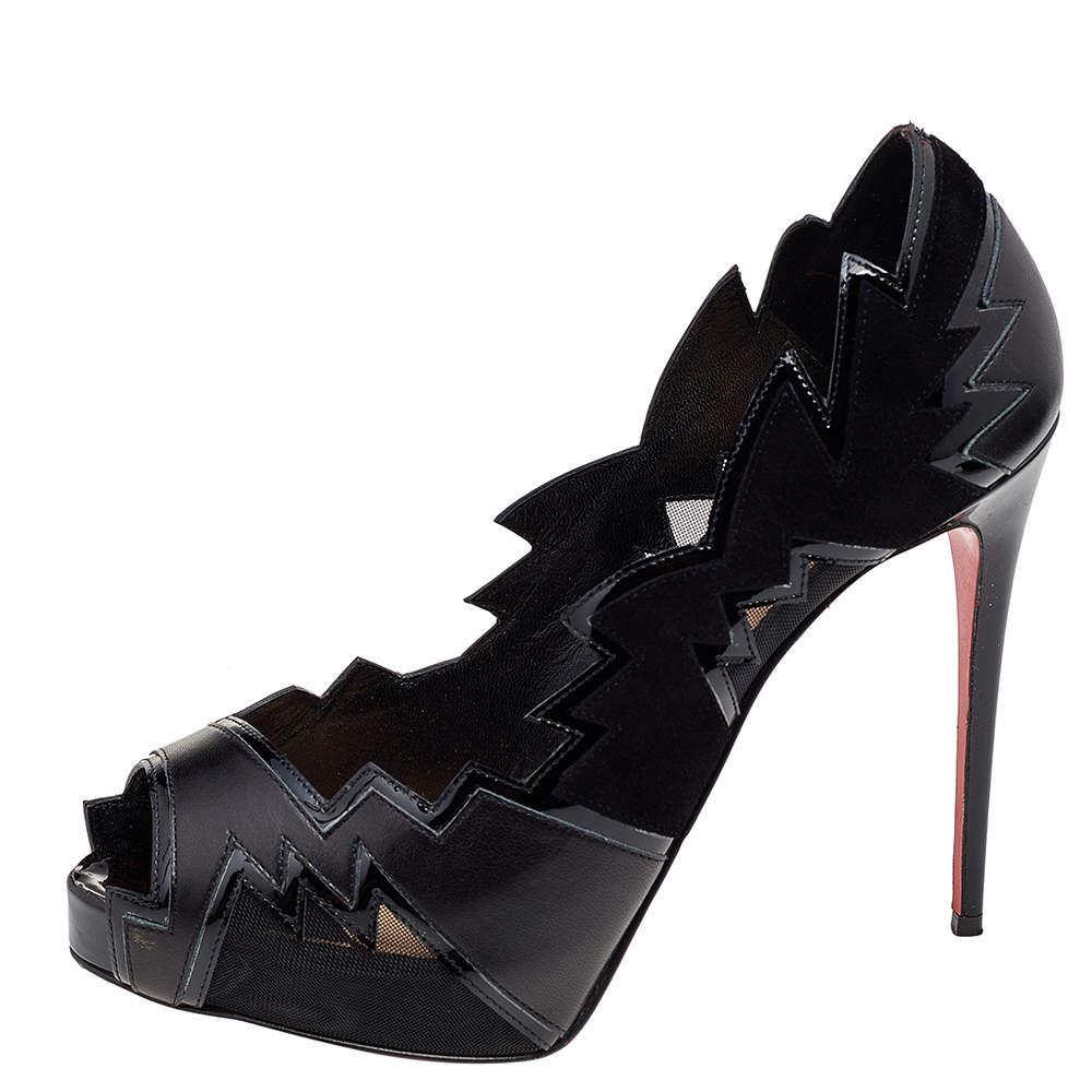 These Explozina pumps by Christian Louboutin define the label's distinctive aesthetics and craftsmanship. Crafted from leather and mesh in a black shade, they feature sleek cuts that exude a rock-chic appeal. Finished off with peep-toes, they are