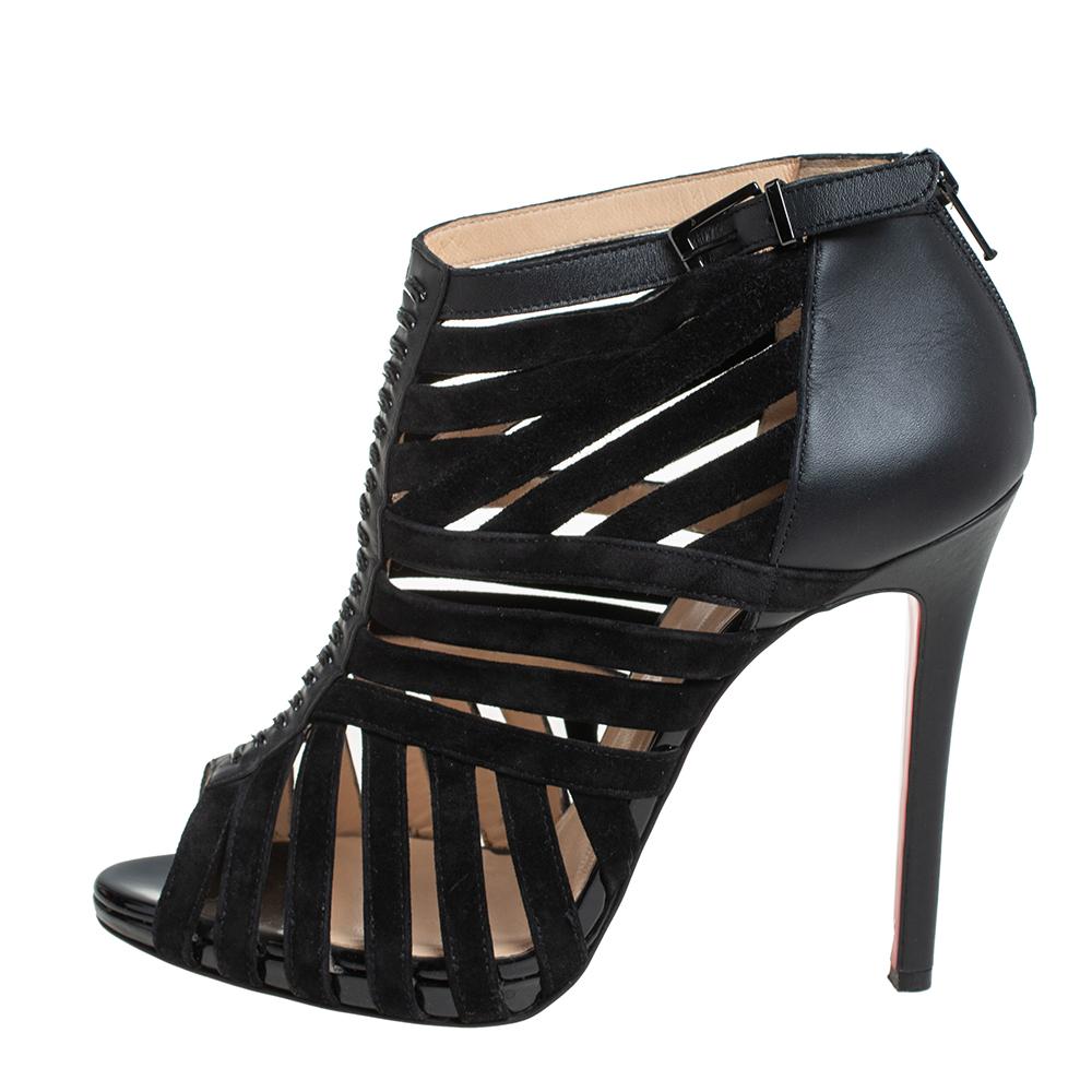 Gorgeously designed to make you look ultra-stylish, these Louboutin booties are one of a kind. Classy in black, these booties are crafted from suede and leather and feature peep-toes with a cage design. They come equipped with zippers on the