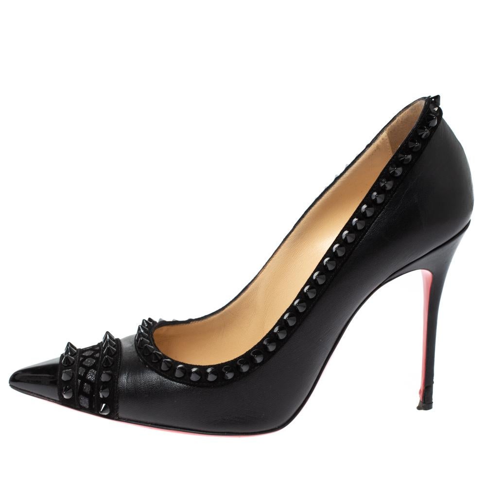 Flaunt this fabulous pair of Christian Louboutin pumps with grace to uplift your style. Made from leather and suede, these pumps add an edge to your personality. They have pointed toes, spike detailing, 10.5 cm heels, and signature red soles.