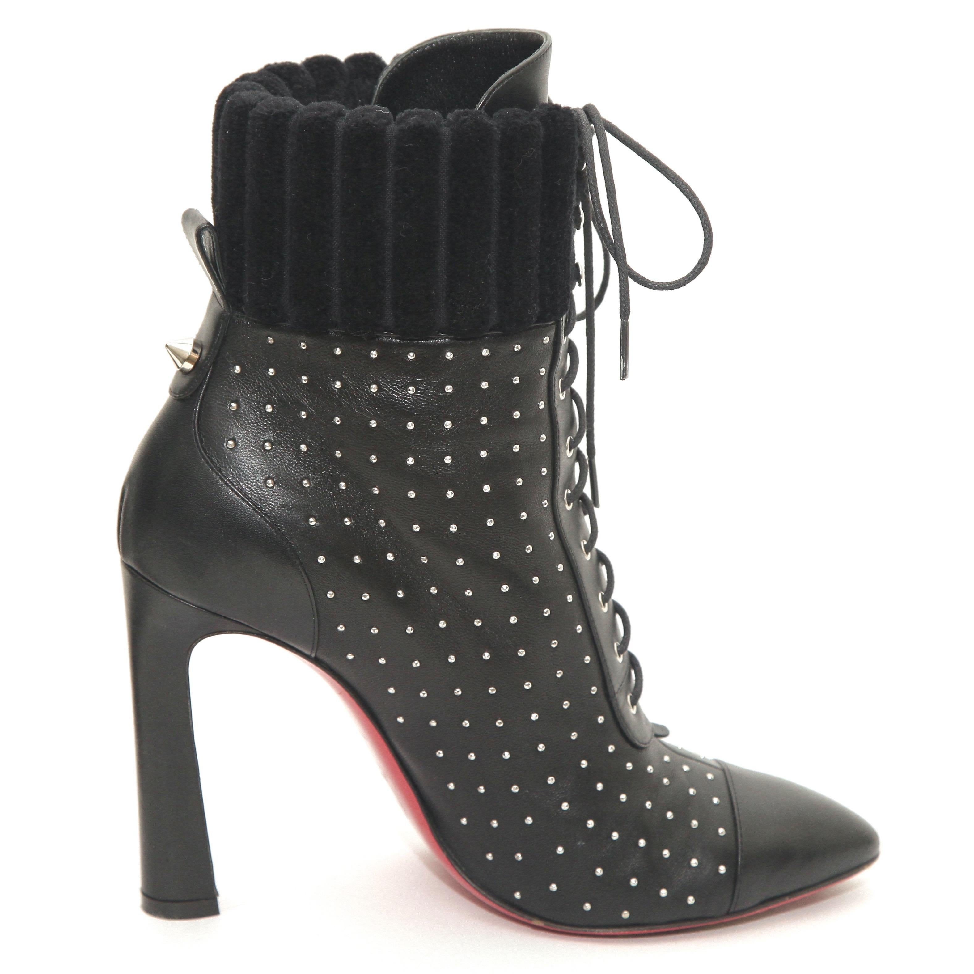 GUARANTEED AUTHENTIC CHRISTIAN LOUBOUTIN SILVER STUDDED LACE UP BOOTS

Details:
- Black leather uppers.
- Tiny silver studs throughout.
- Lace-up front.
- Fabric trim around top.
- Almond cap toe.
- Leather insoles/soles.
- Comes with dust