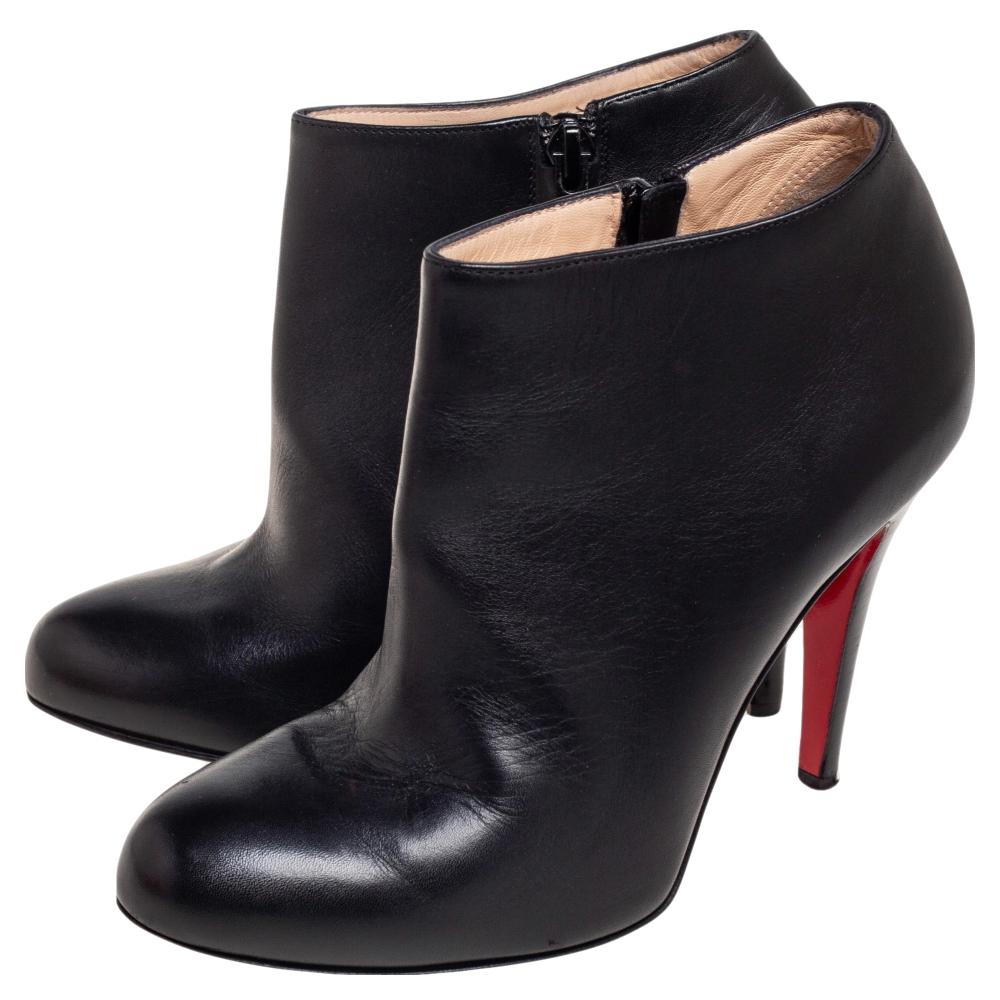 These ankle boots from Christian Louboutin epitomize the concept of 'less is more'. They are crafted from black leather and designed with covered toes and zip closure on the sides. They are equipped with comfortable leather-lined insoles and